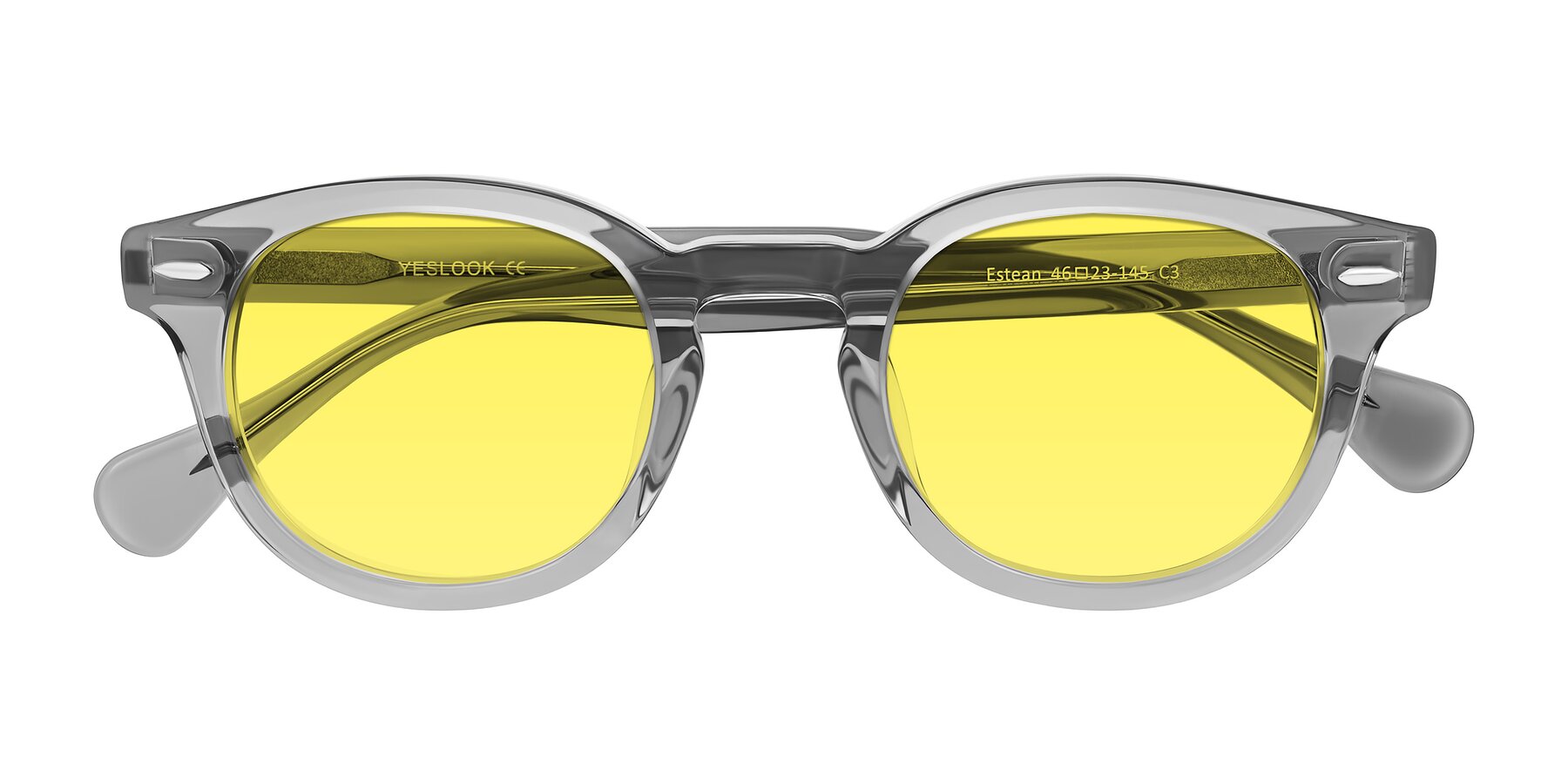 Folded Front of Estean in Transparent Gray with Medium Yellow Tinted Lenses