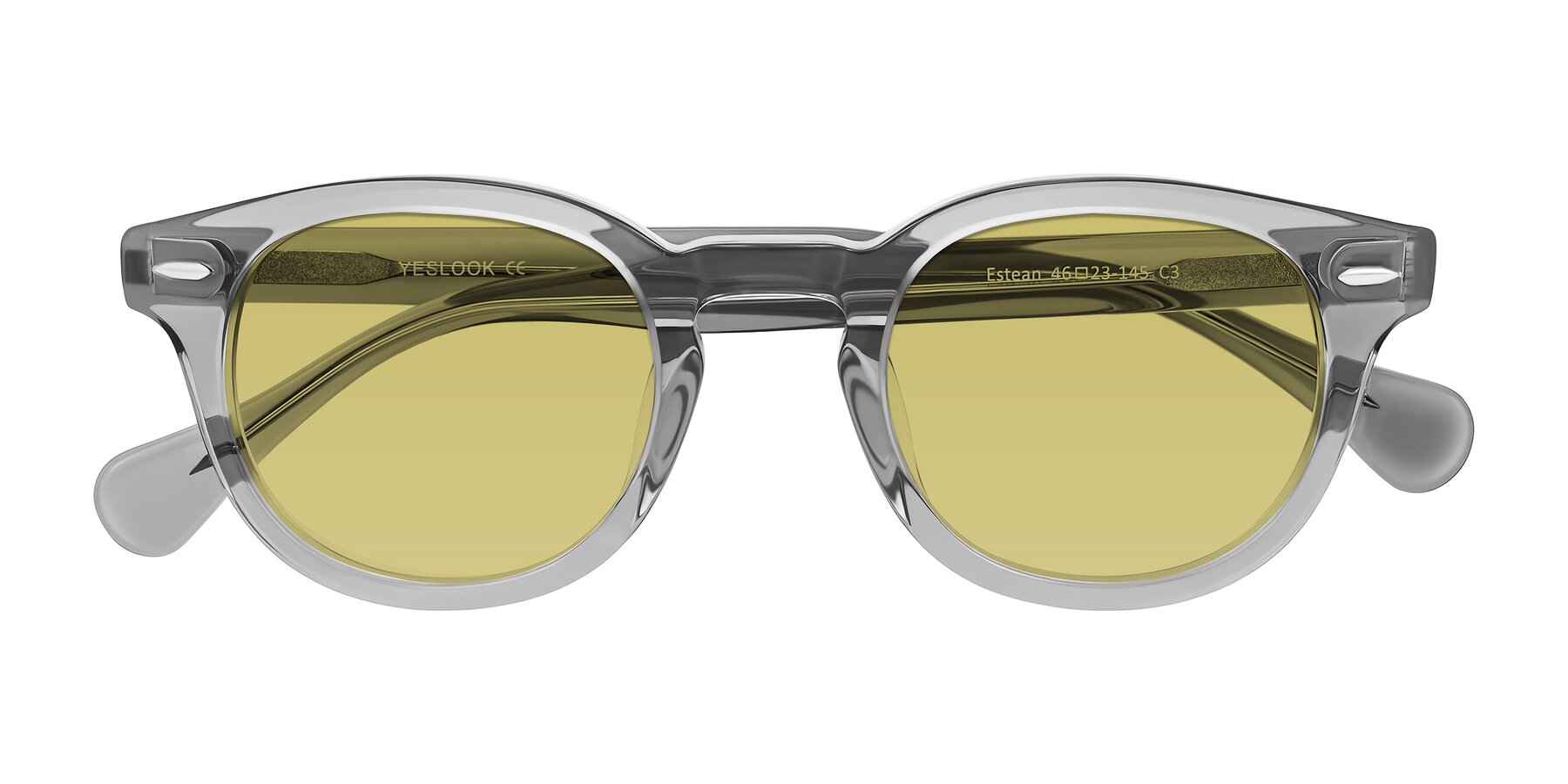 Folded Front of Estean in Transparent Gray with Medium Champagne Tinted Lenses