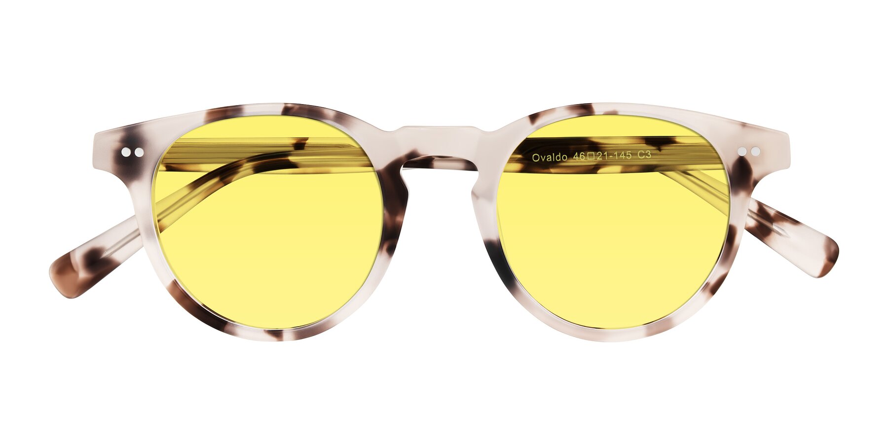 Folded Front of Ovaldo in Ivory Tortoise with Medium Yellow Tinted Lenses