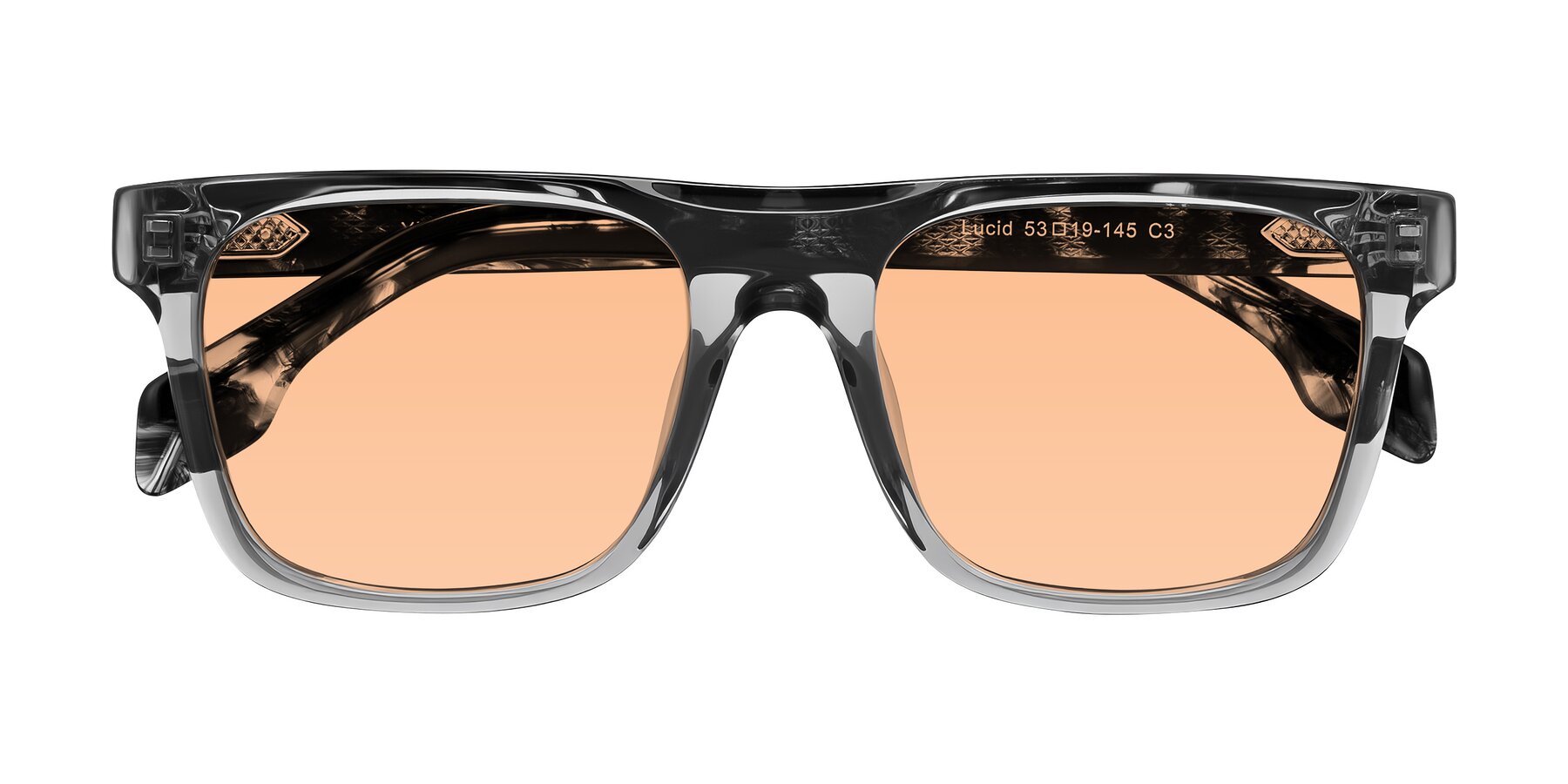 Folded Front of Lucid in Transparent Gray/Tortoise with Light Orange Tinted Lenses