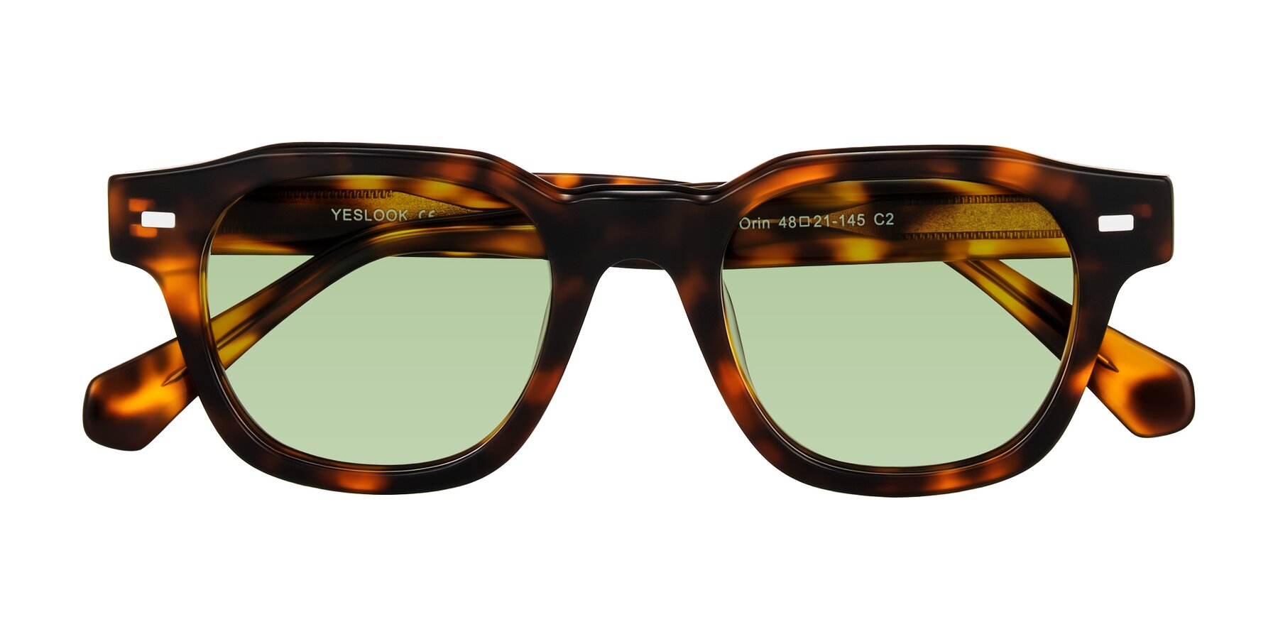 Folded Front of Orin in Tortoise with Medium Green Tinted Lenses
