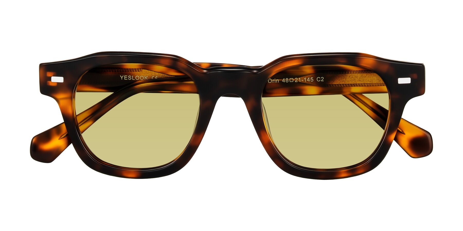 Folded Front of Orin in Tortoise with Medium Champagne Tinted Lenses