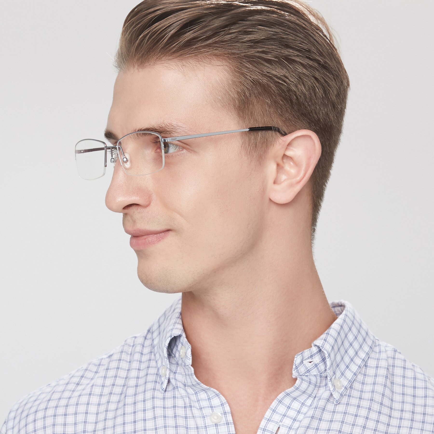 Men's lifestyle photography of Philip in Silver with Clear Reading Eyeglass Lenses