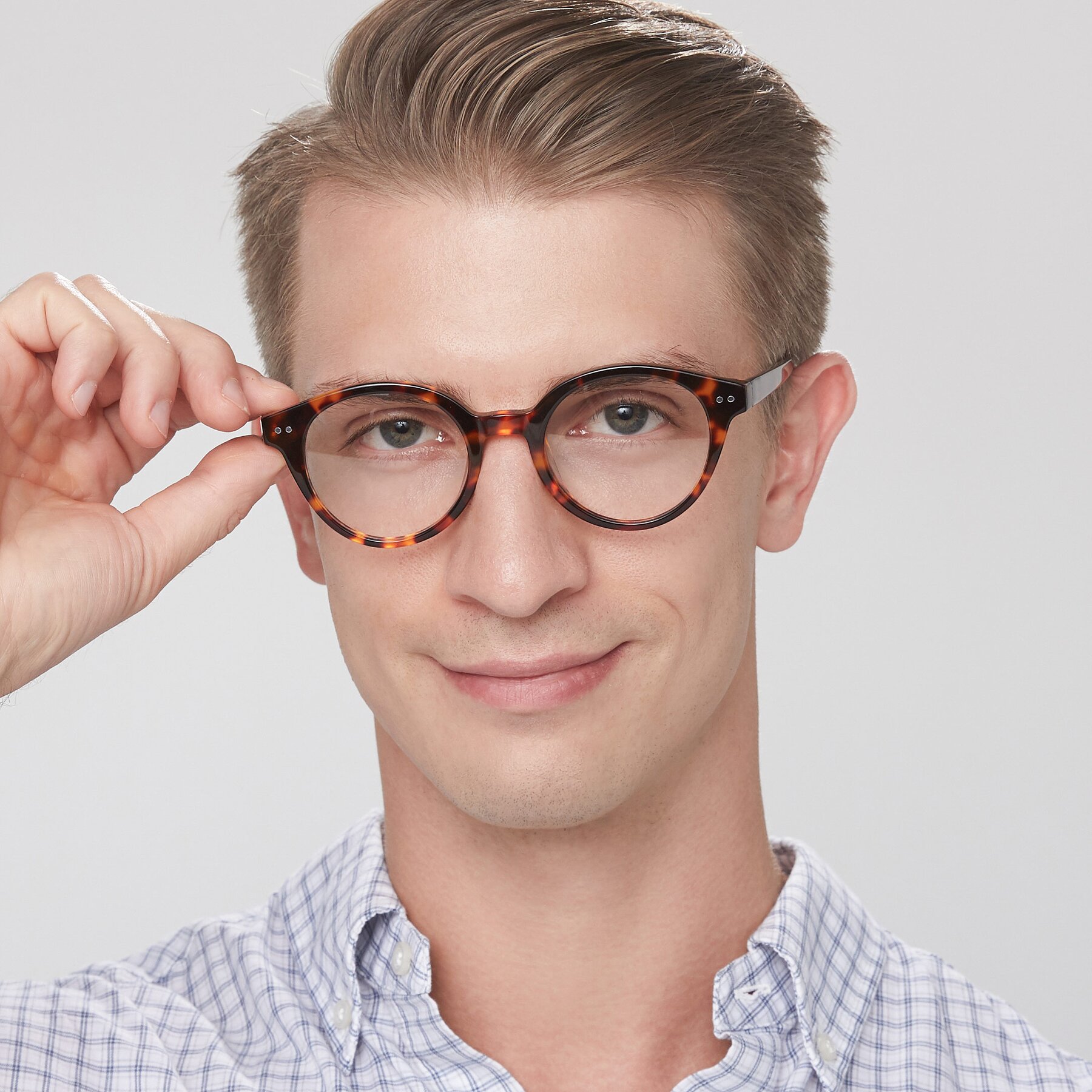 Men's lifestyle photography of Bellion in Tortoise with Clear Eyeglass Lenses