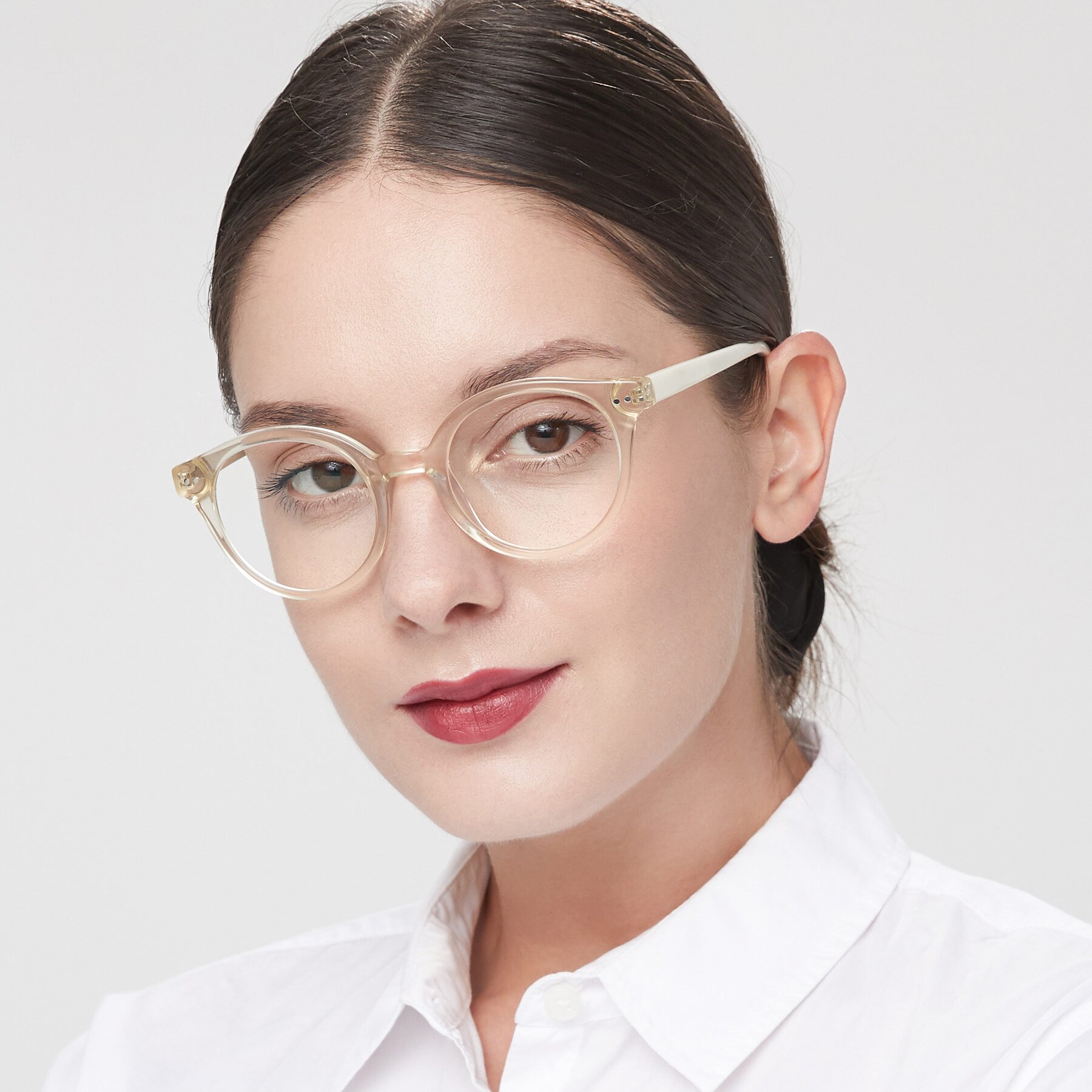 Women's lifestyle photography of Bellion in Transparent Beige with Clear Eyeglass Lenses