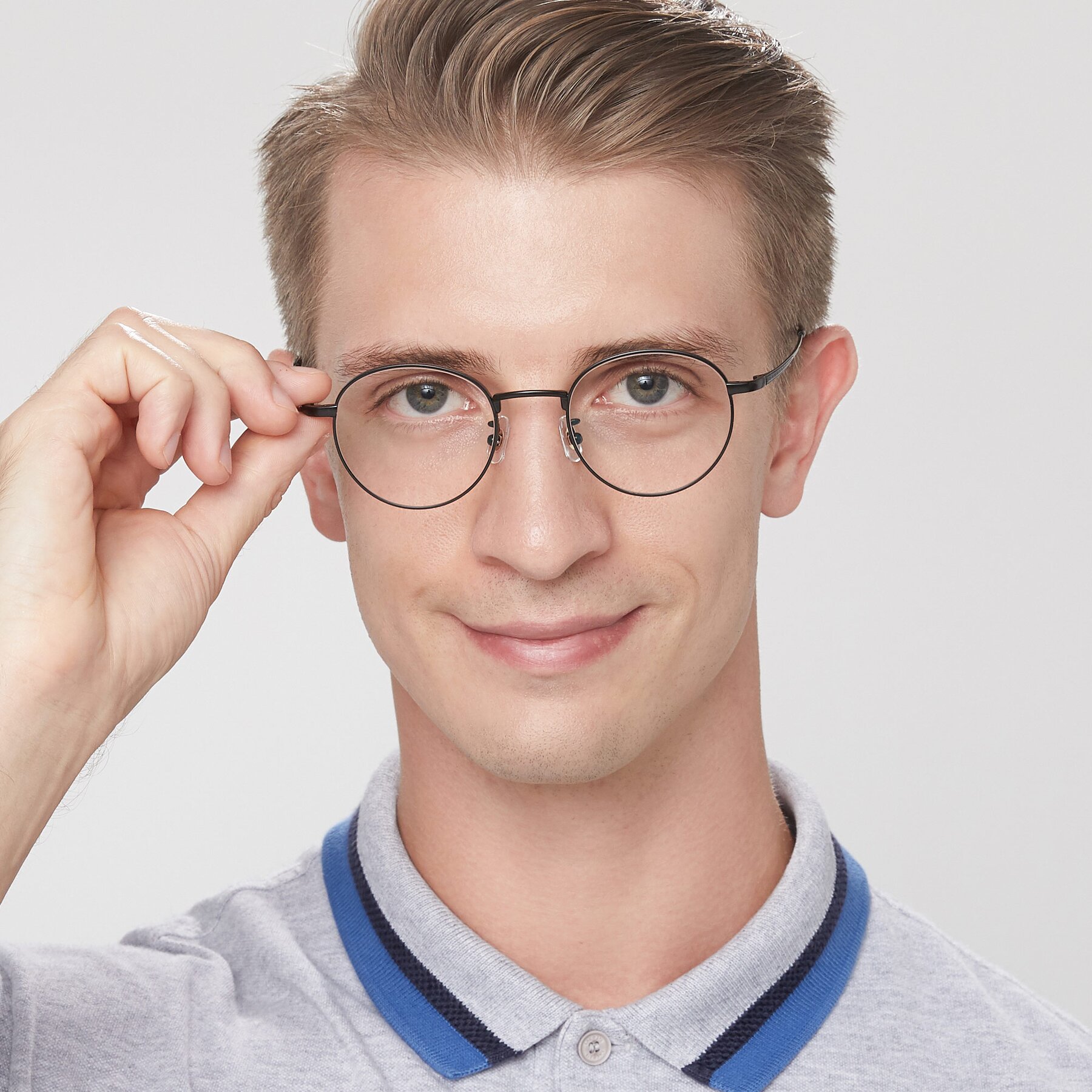 Men's lifestyle photography of Lindsey in Matte Black with Clear Eyeglass Lenses