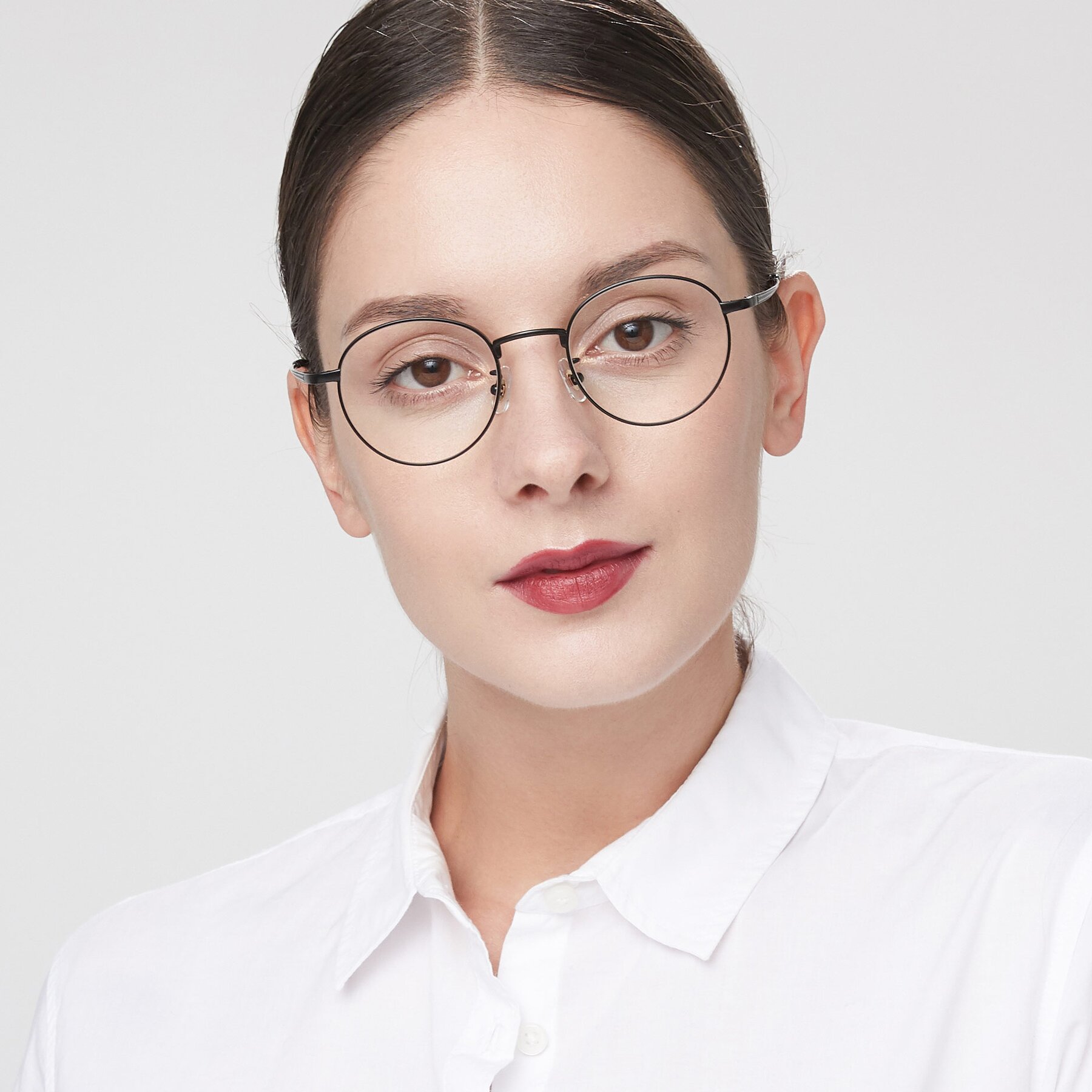 Women's lifestyle photography of Lindsey in Matte Black with Clear Eyeglass Lenses
