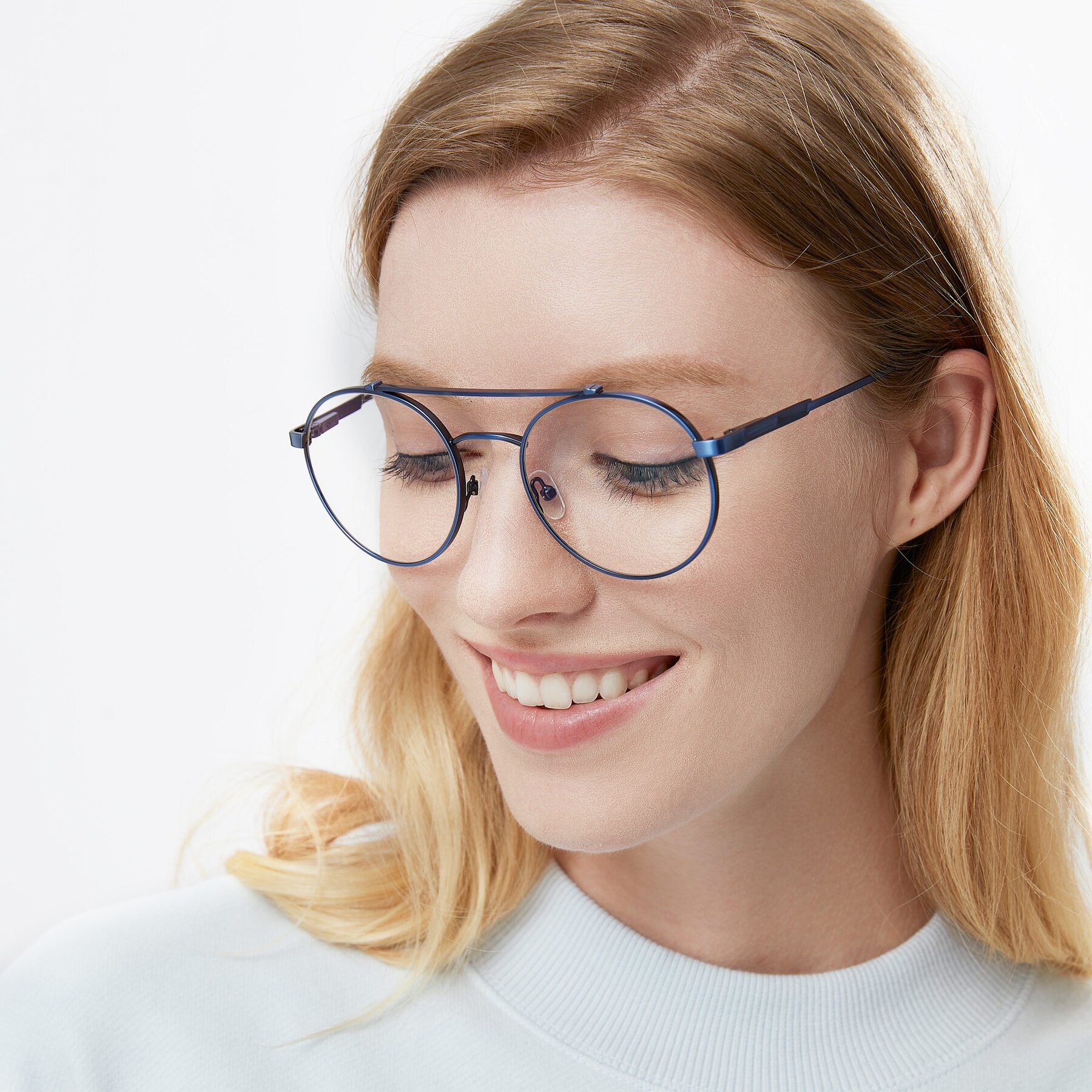 Women's lifestyle photography of 9490 in Antique Blue with Clear Blue Light Blocking Lenses