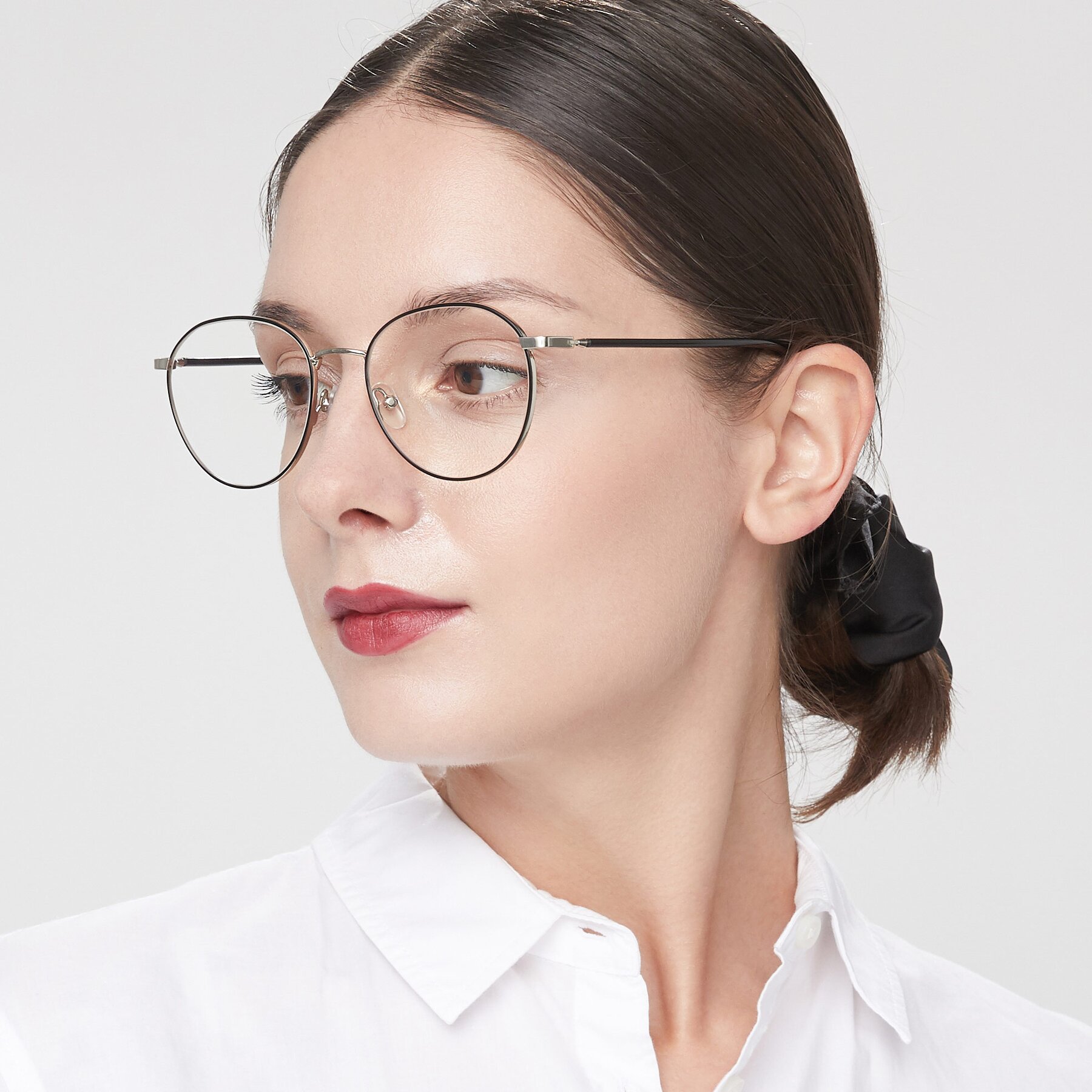 Women's lifestyle photography of 9553 in Black-Silver with Clear Eyeglass Lenses