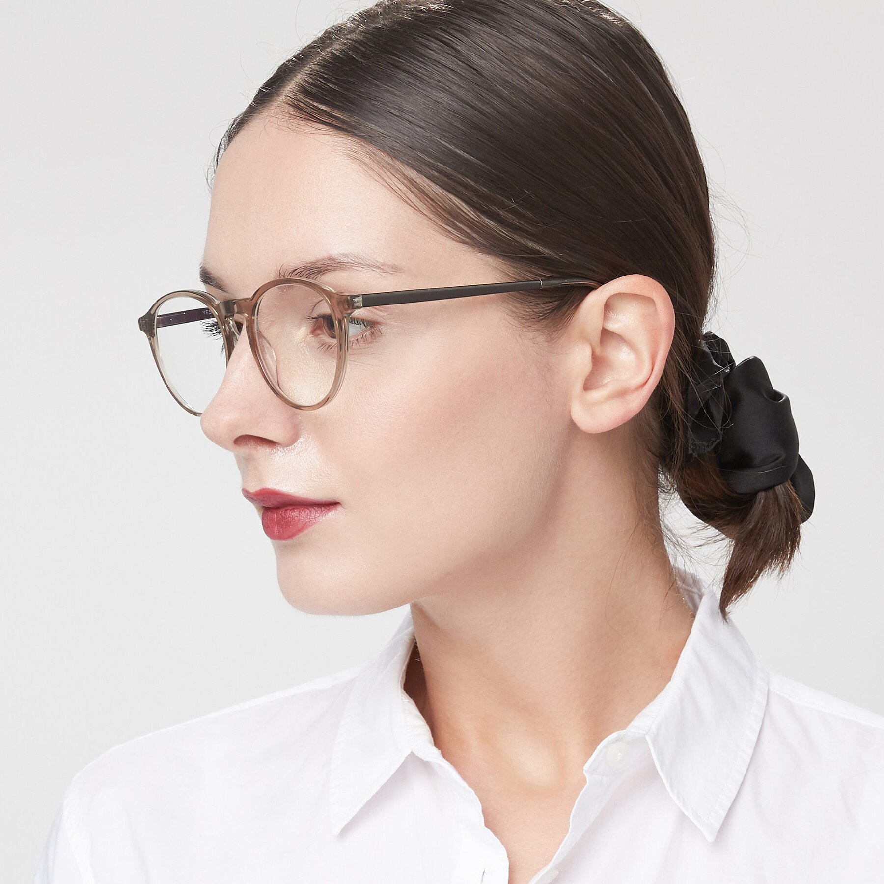 Women's lifestyle photography of 17450 in Transparent Brown with Clear Eyeglass Lenses