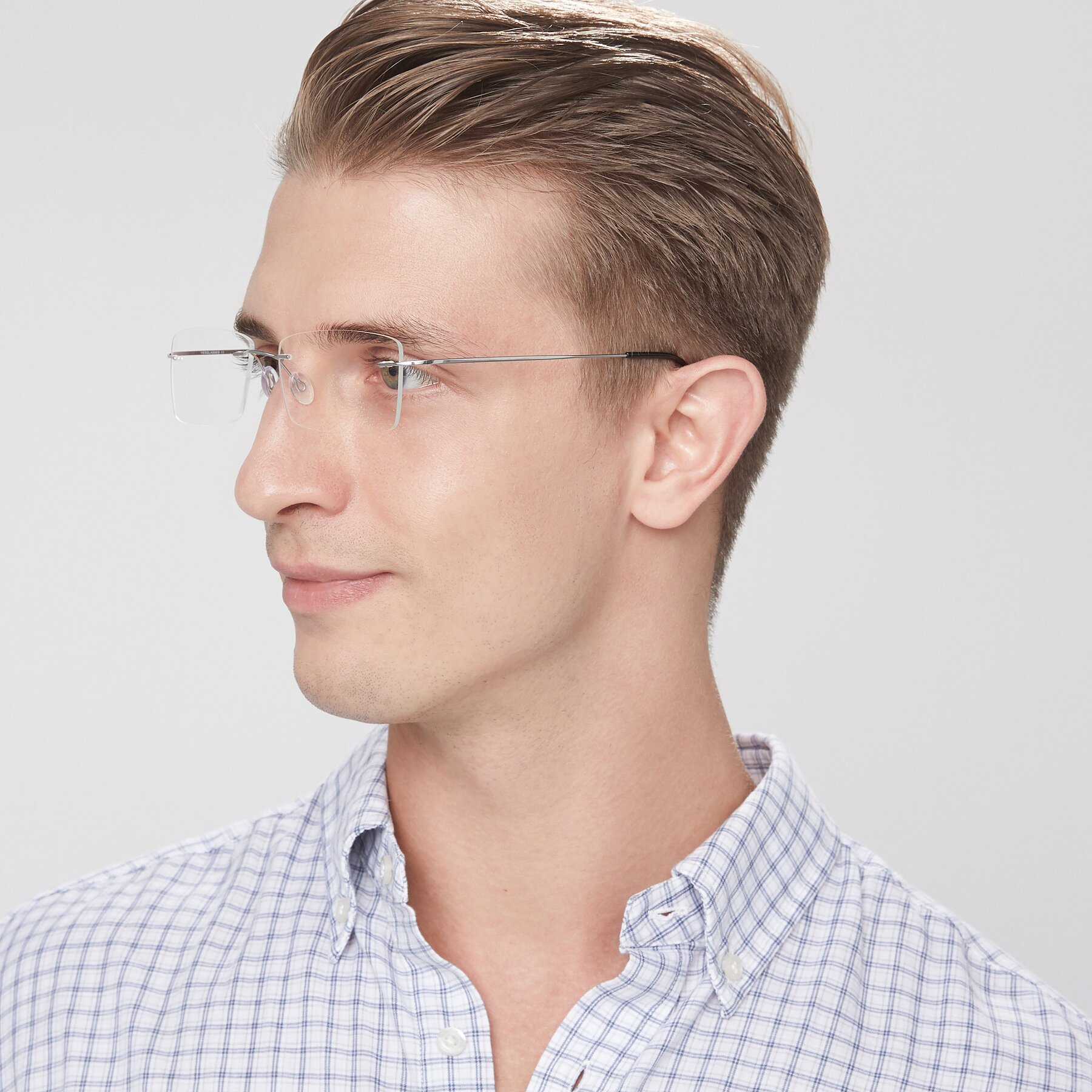 Men's lifestyle photography of Wall in Silver with Clear Eyeglass Lenses
