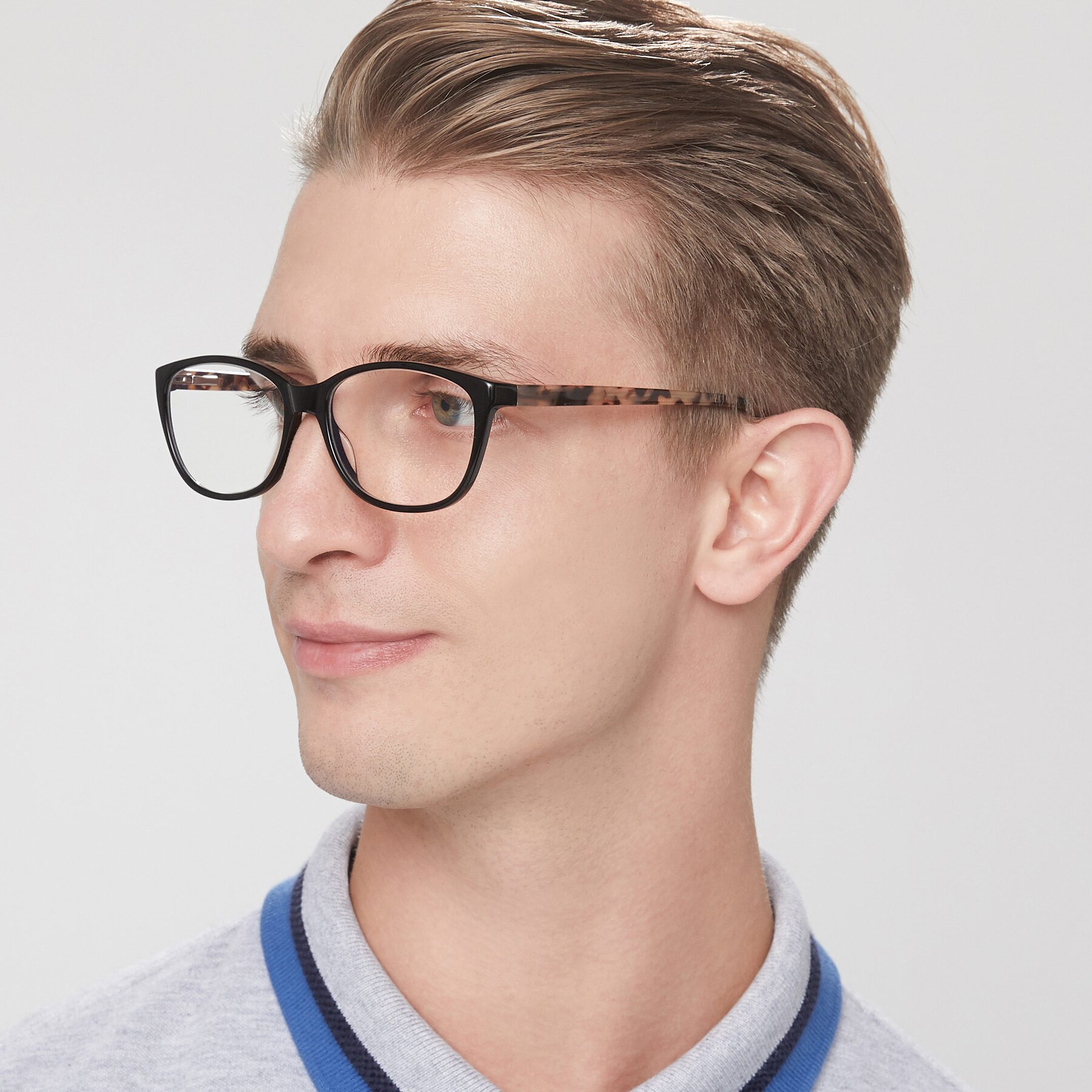 Men's lifestyle photography of Xavier in Black with Clear Eyeglass Lenses