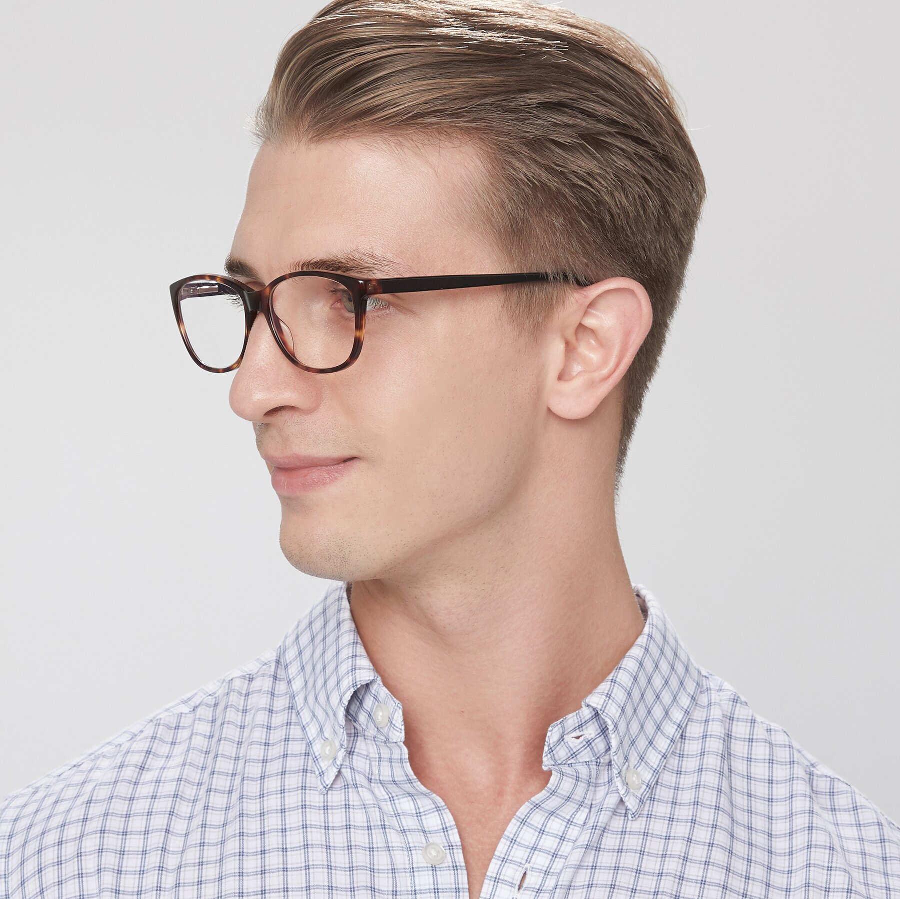 Men's lifestyle photography of Xavier in Tortoise with Clear Blue Light Blocking Lenses