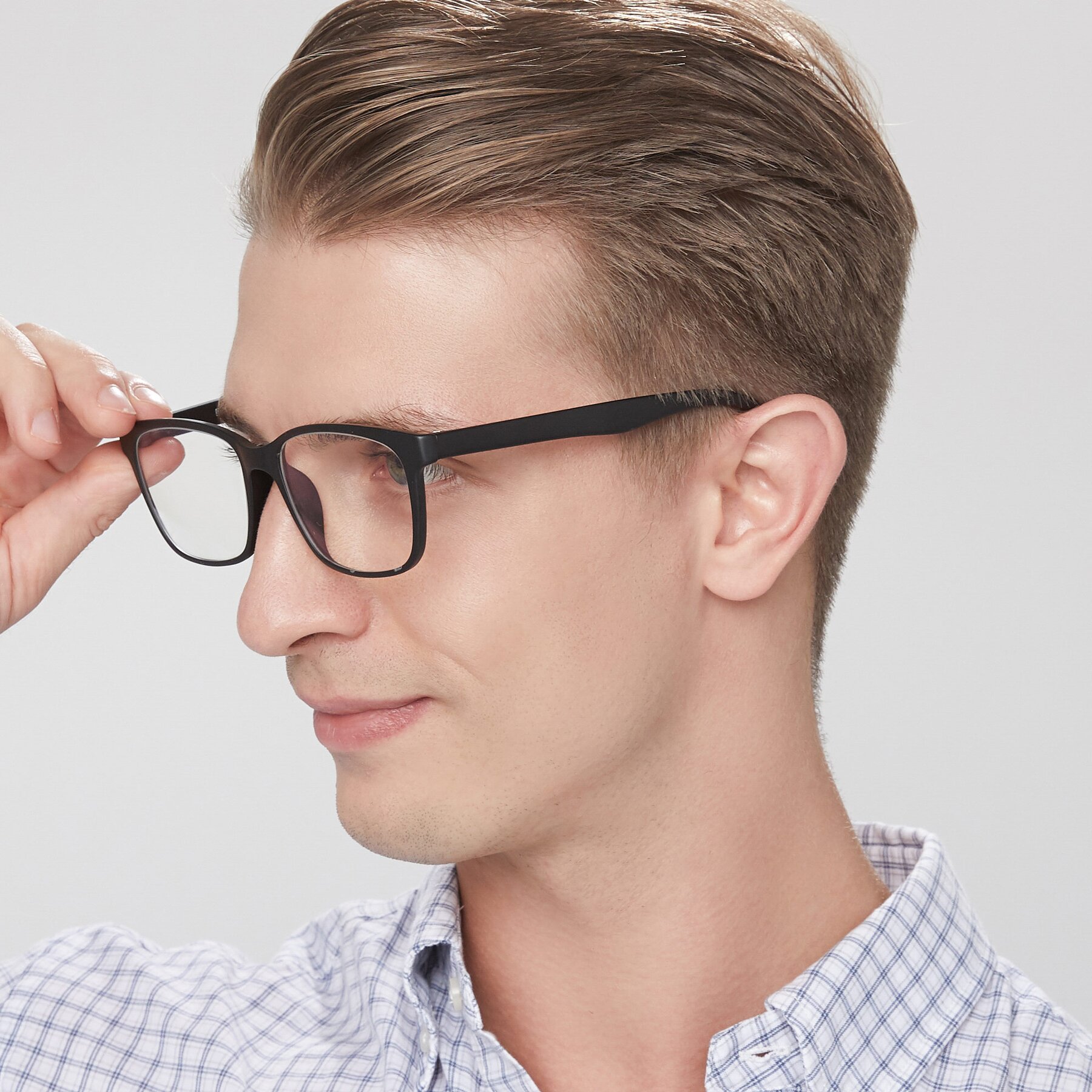 Men's lifestyle photography of 8206 in Matte Black with Clear Eyeglass Lenses