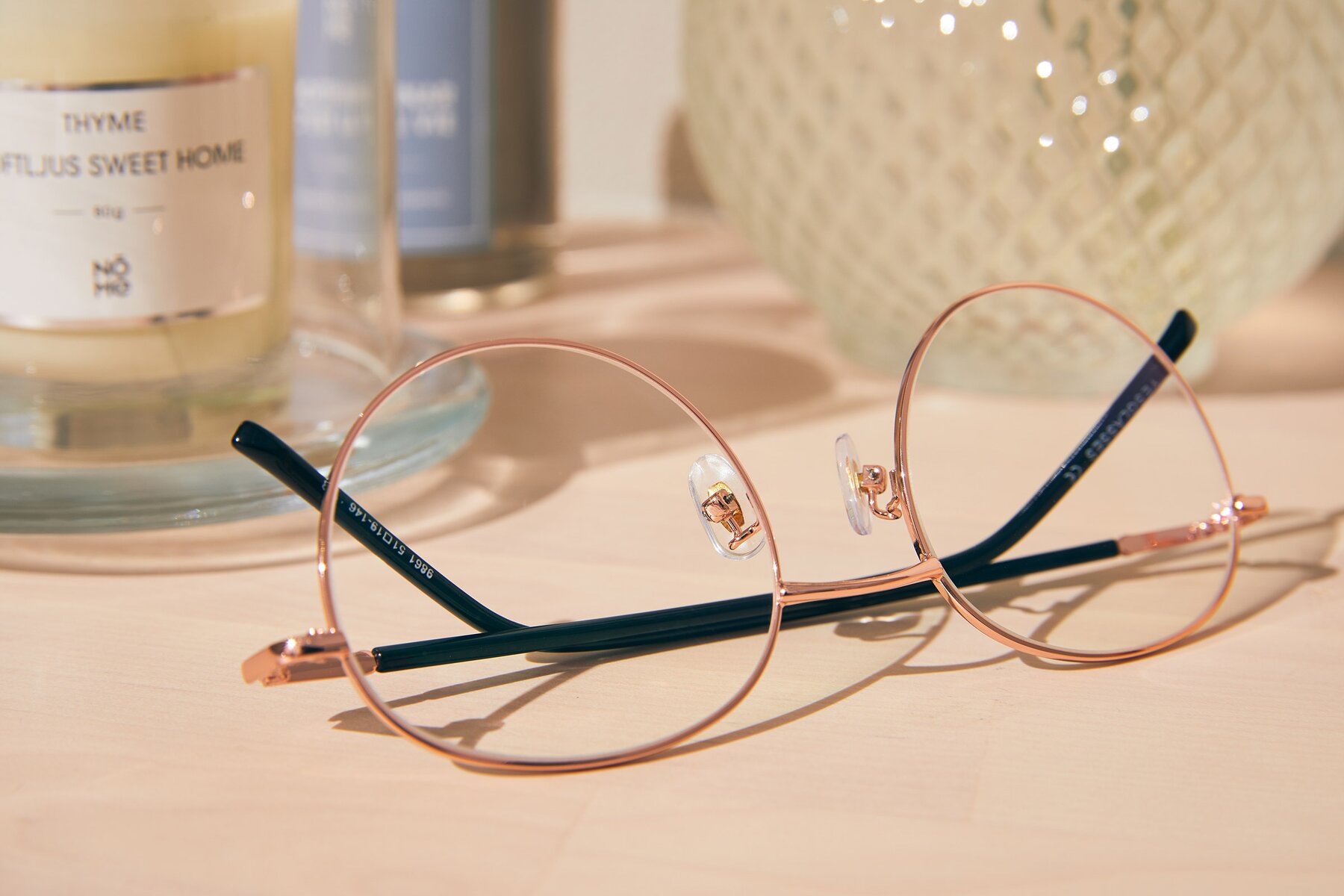 Women's lifestyle photography #2 of Cosmos in Rose Gold with Clear Blue Light Blocking Lenses