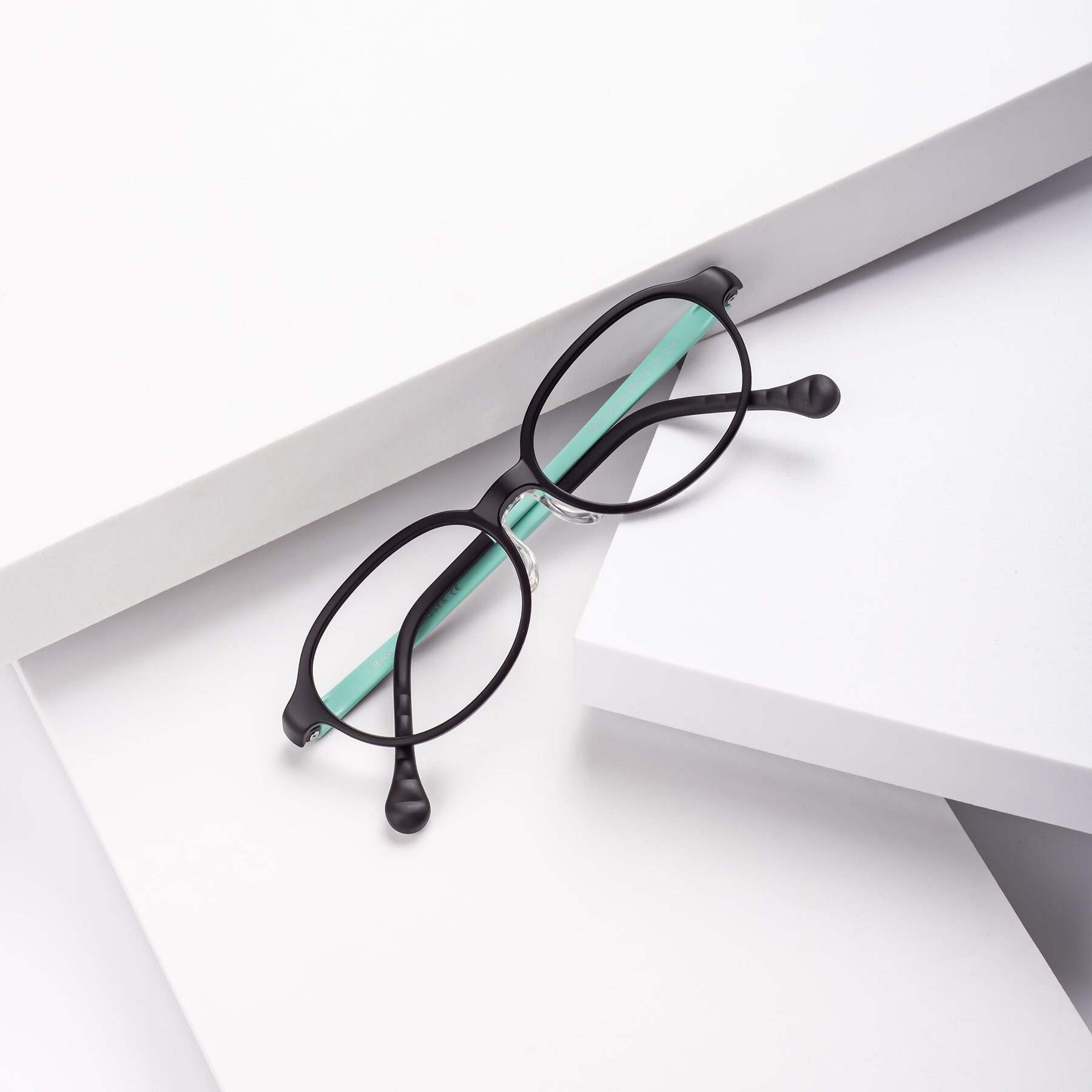 Lifestyle photography #1 of Reece in Black-Teal with Clear Eyeglass Lenses