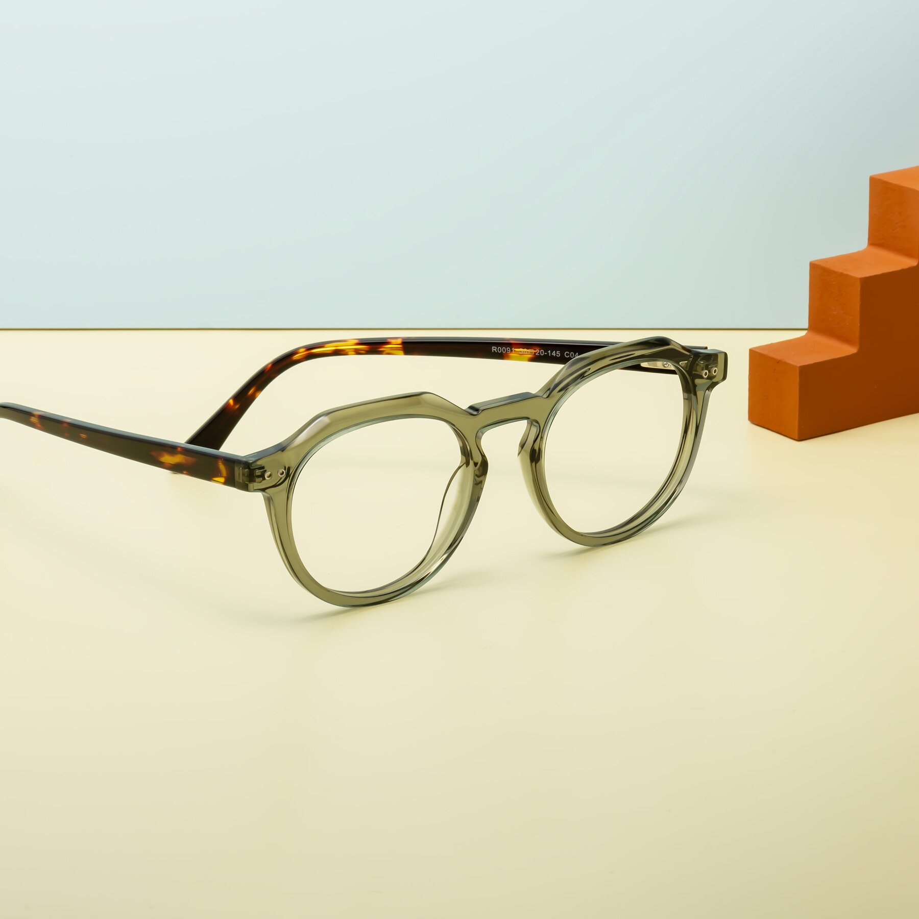 Lifestyle photography #2 of Dyson in Transparent Green-Tortoise with Clear Eyeglass Lenses