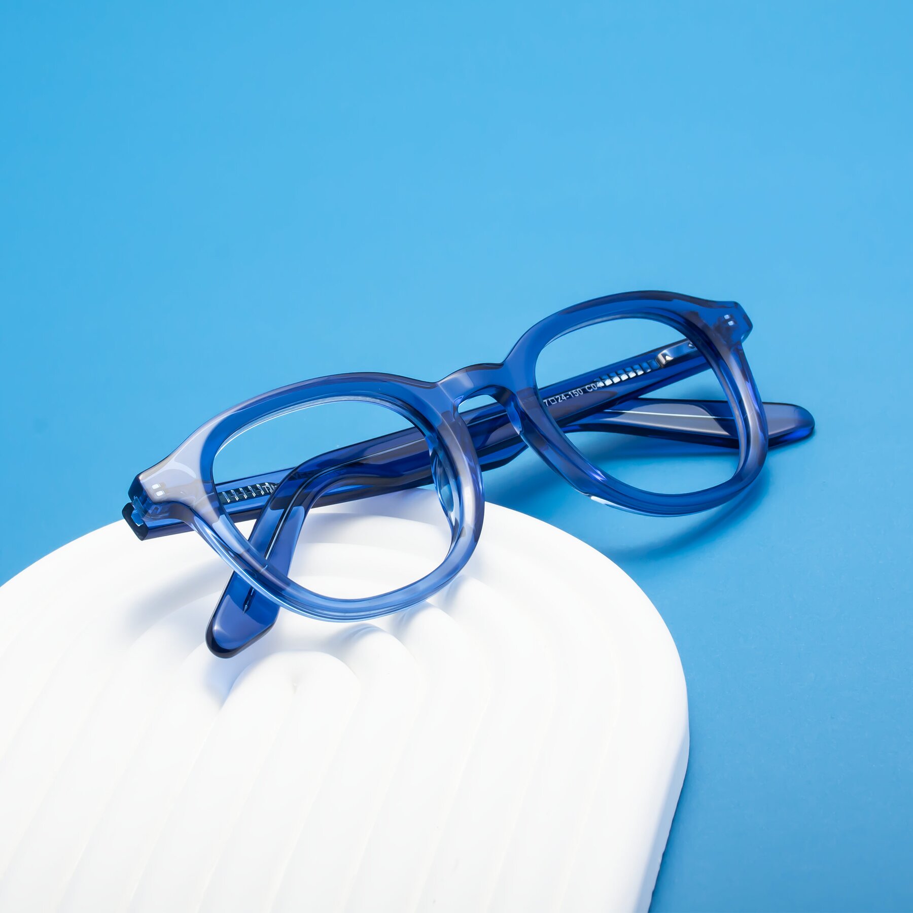 Lifestyle photography #1 of Titus in Translucent Blue with Clear Eyeglass Lenses