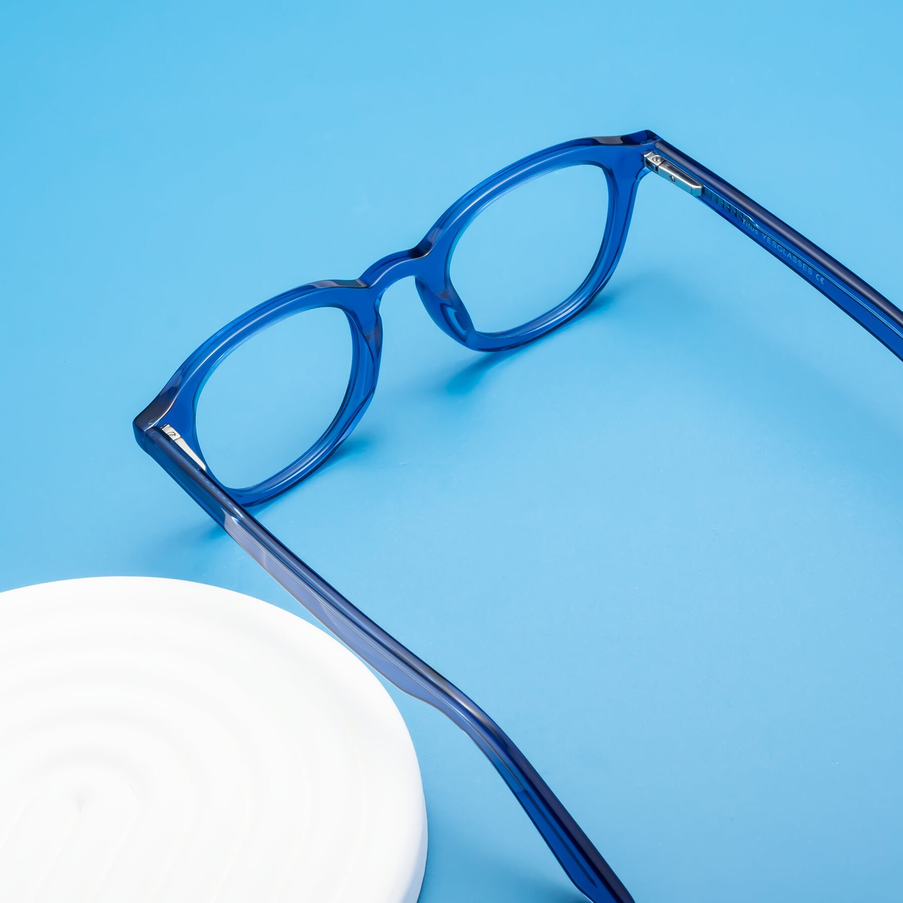Lifestyle photography #2 of Titus in Translucent Blue with Clear Eyeglass Lenses