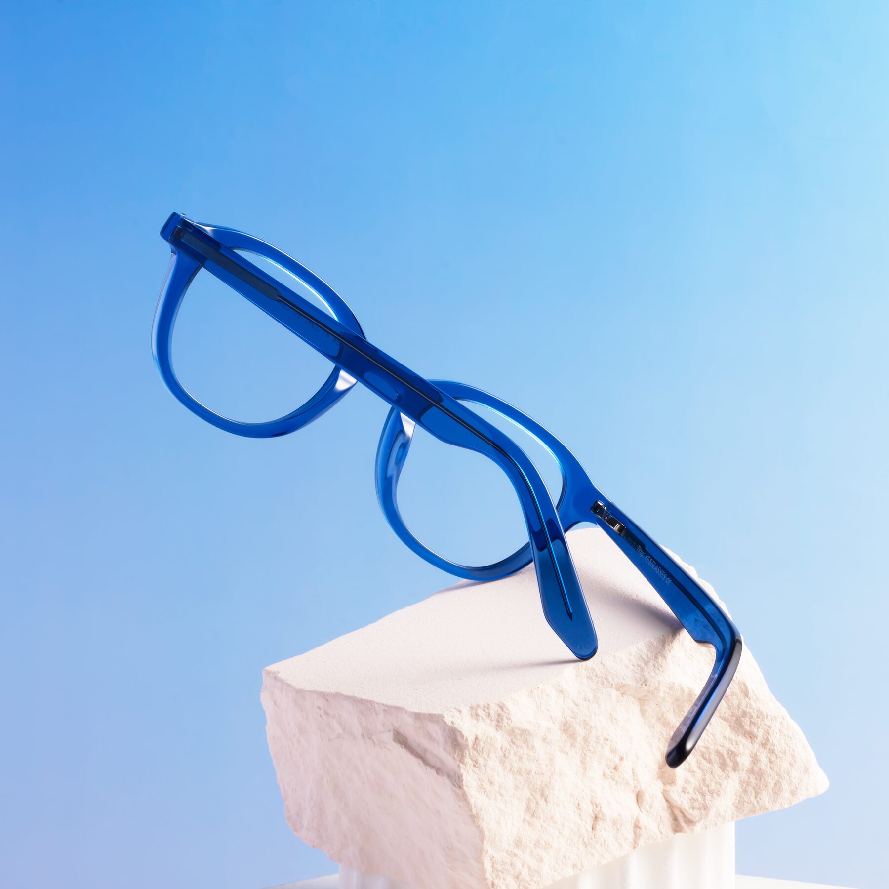 Lifestyle photography #2 of Titus in Translucent Blue with Clear Reading Eyeglass Lenses