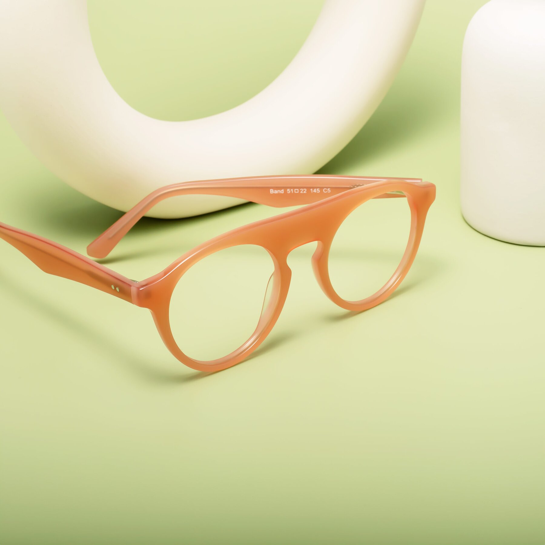 Lifestyle photography #2 of Band in Peach with Clear Eyeglass Lenses