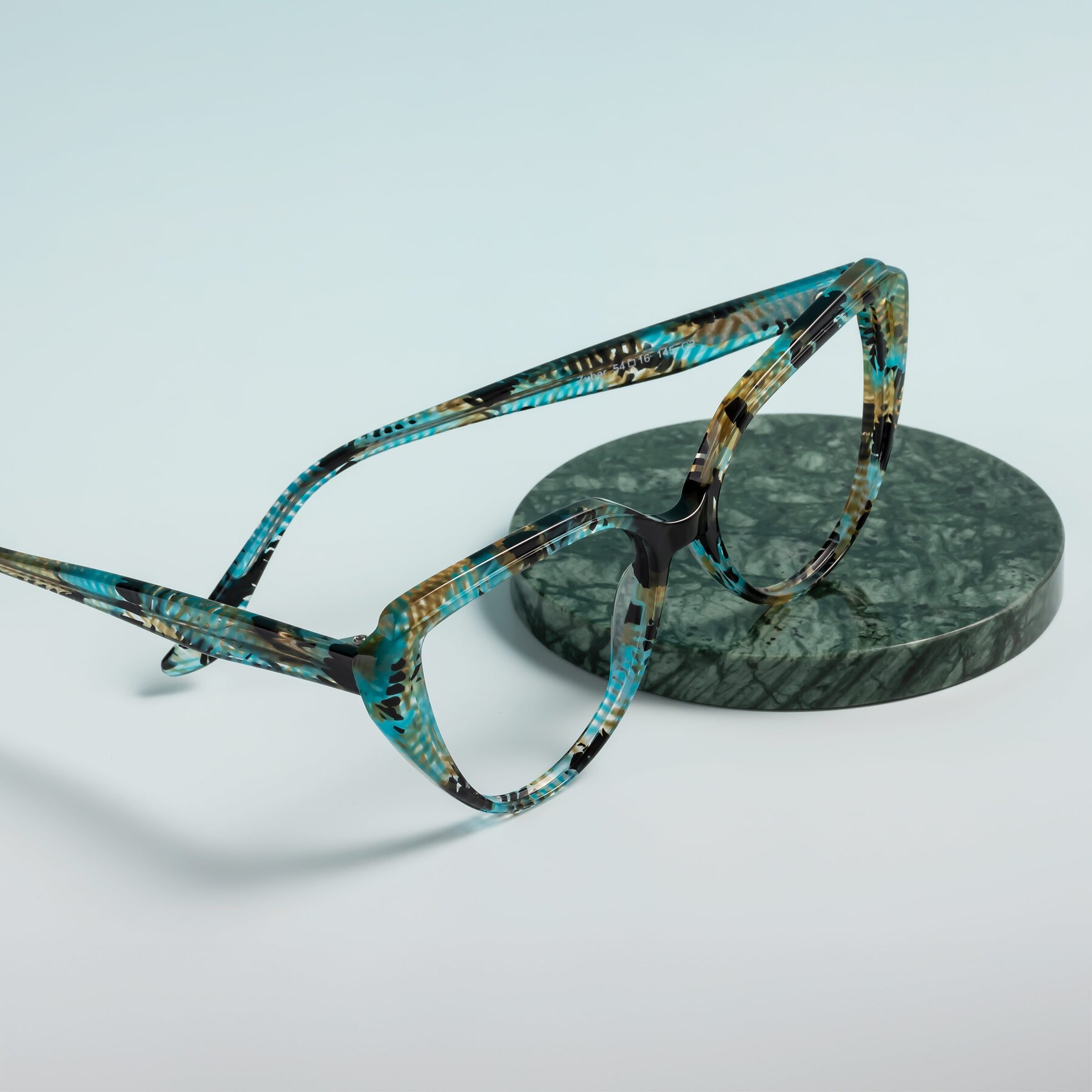 Women's lifestyle photography #2 of Zubar in Cyan Snake Print with Clear Reading Eyeglass Lenses