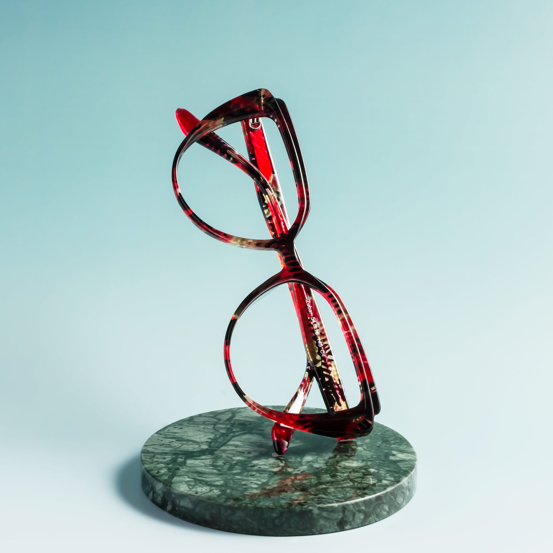 Women's lifestyle photography #1 of Zubar in Wine Snake Print with Clear Reading Eyeglass Lenses
