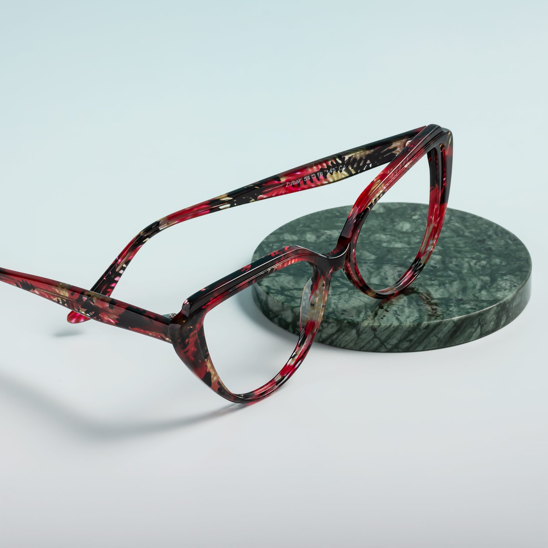 Women's lifestyle photography #2 of Zubar in Wine Snake Print with Clear Reading Eyeglass Lenses