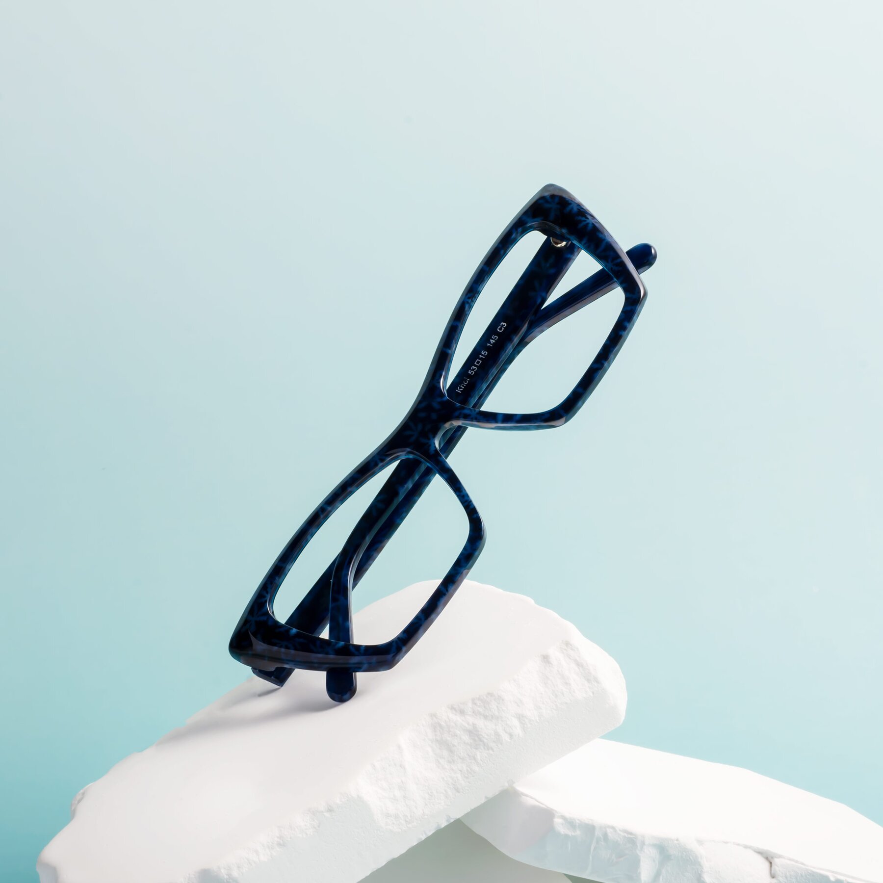 Lifestyle photography #1 of Khoi in Blue Snowflake with Clear Eyeglass Lenses