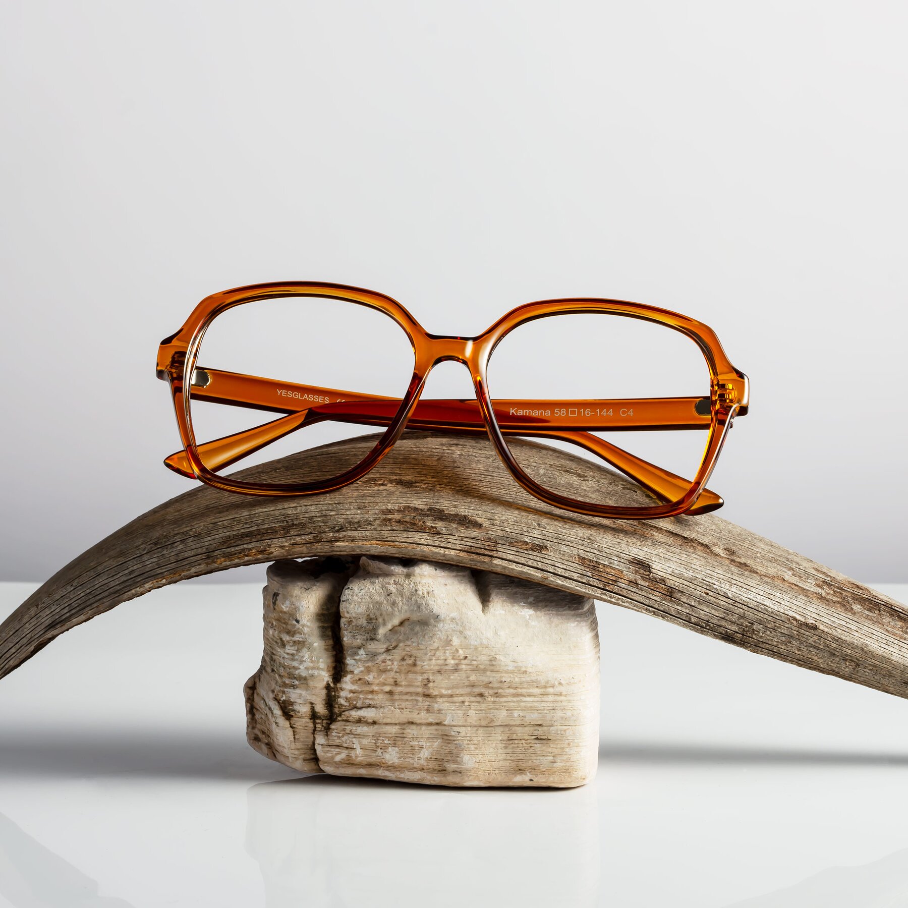 Women's lifestyle photography #1 of Kamana in Maple Syrup with Clear Blue Light Blocking Lenses
