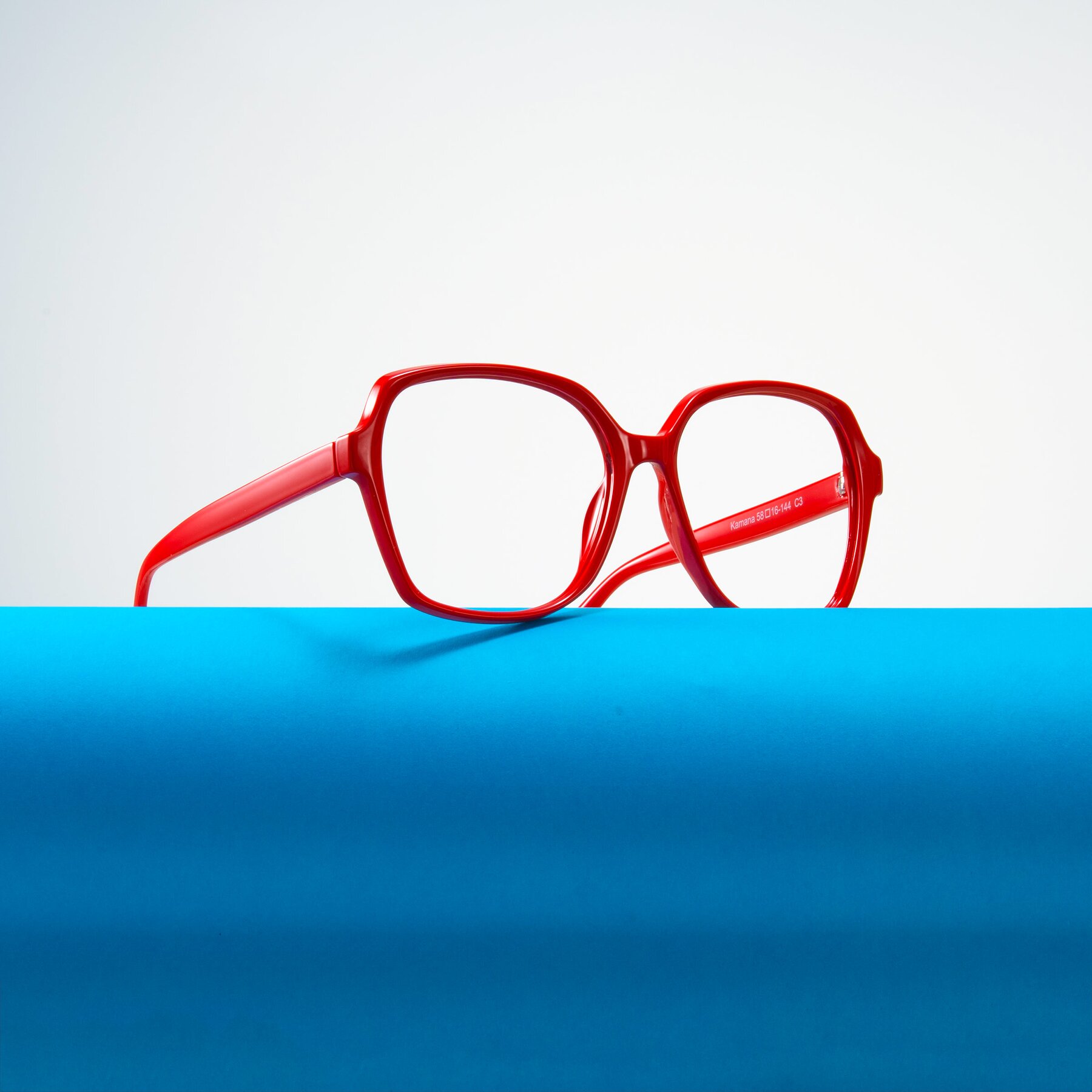 Lifestyle photography #1 of Kamana in Red with Clear Reading Eyeglass Lenses