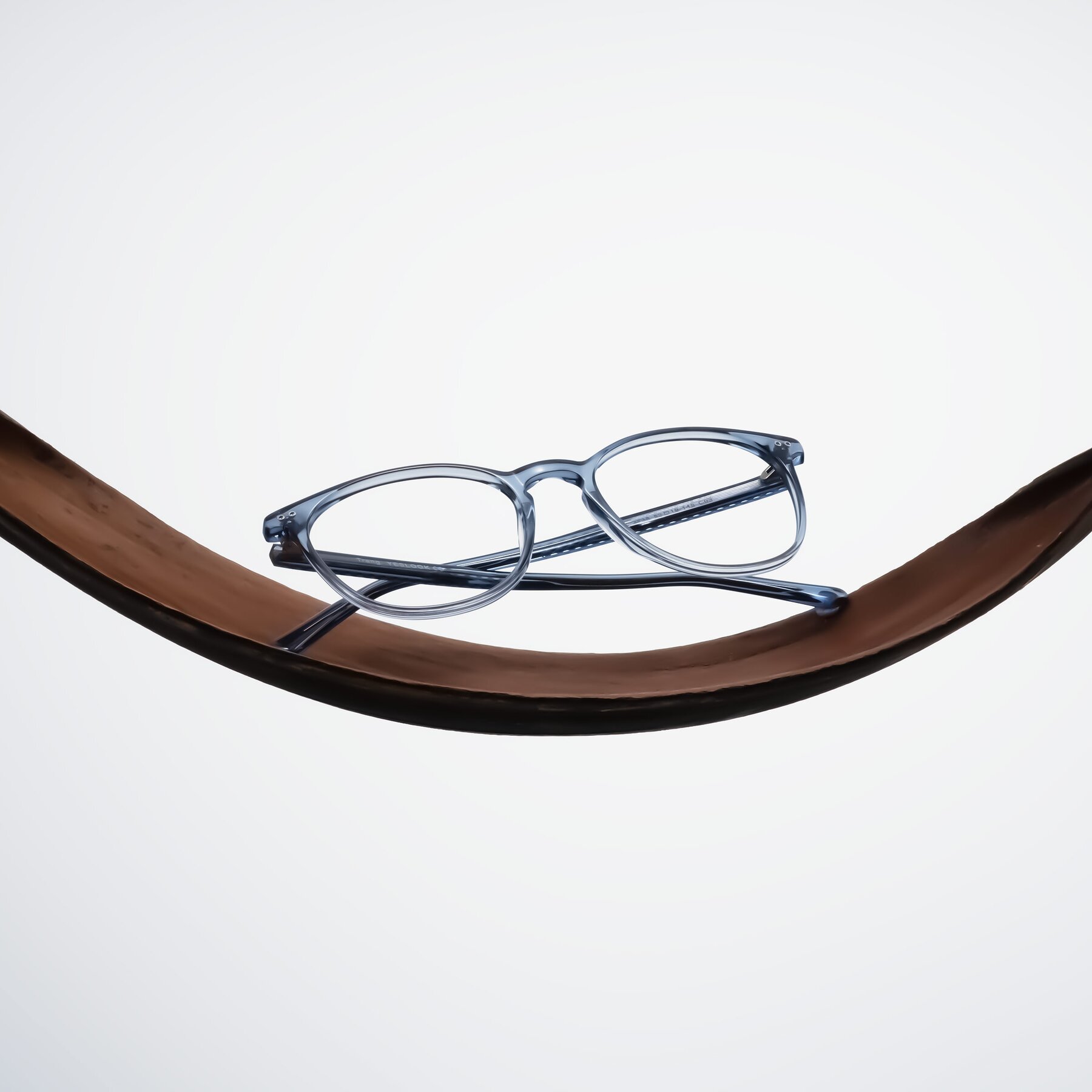 Lifestyle photography #1 of Trang in Transparent Blue with Clear Reading Eyeglass Lenses
