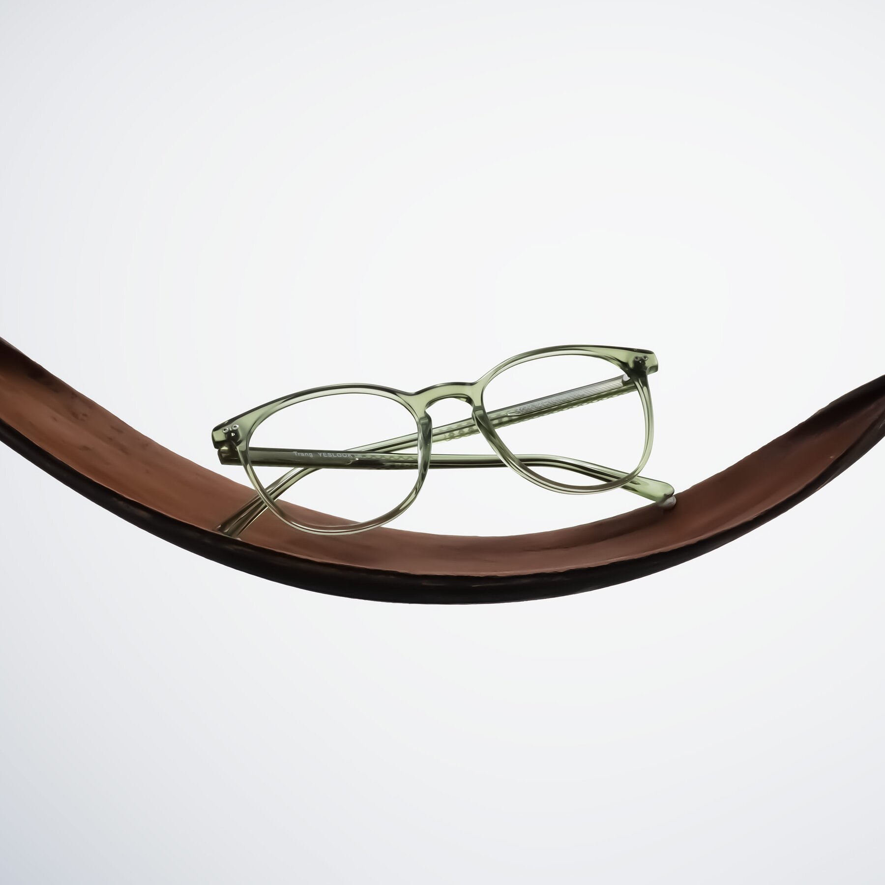 Lifestyle photography #1 of Trang in Transparent Green with Clear Eyeglass Lenses