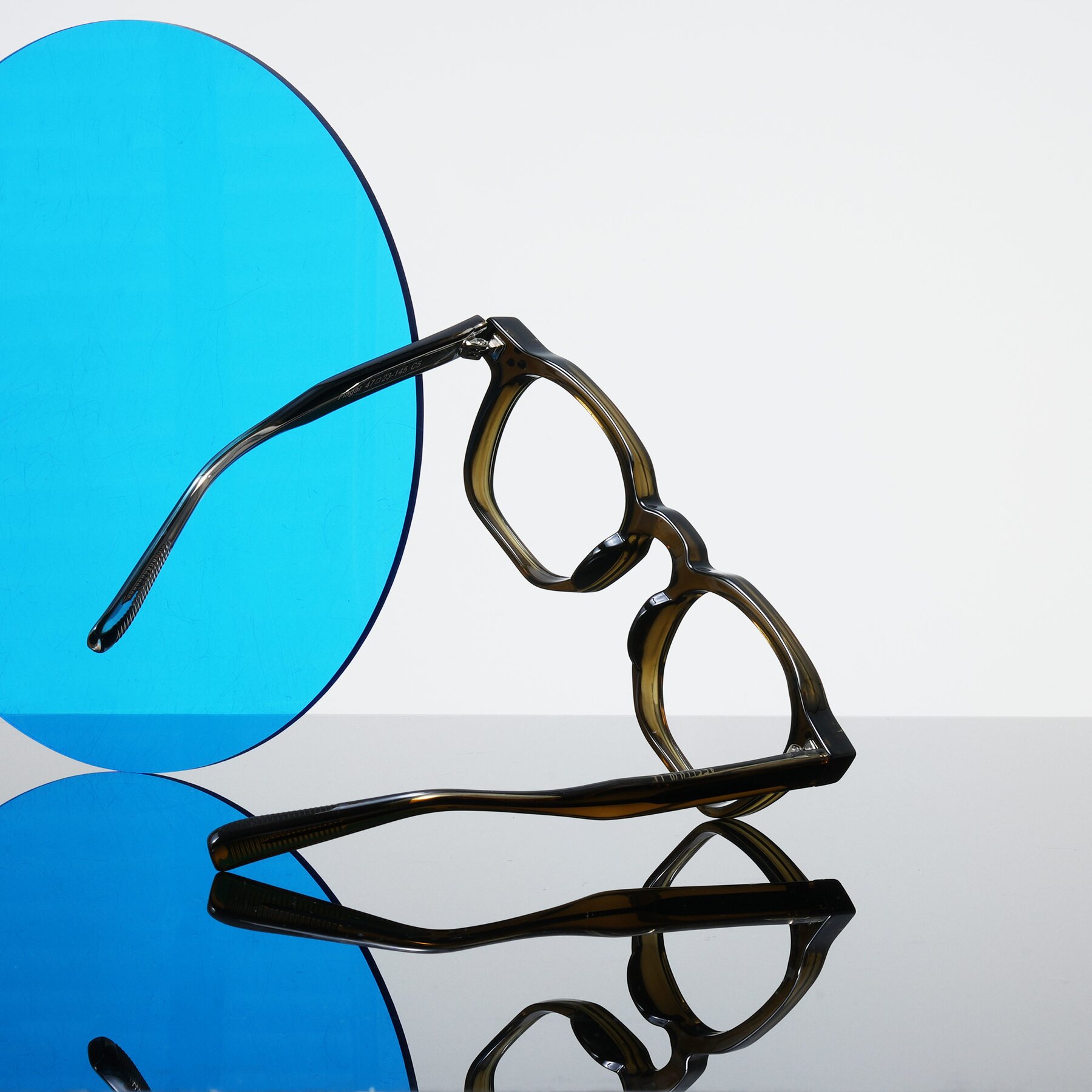Lifestyle photography #1 of Fingar in Translucent Olive Gray with Clear Eyeglass Lenses
