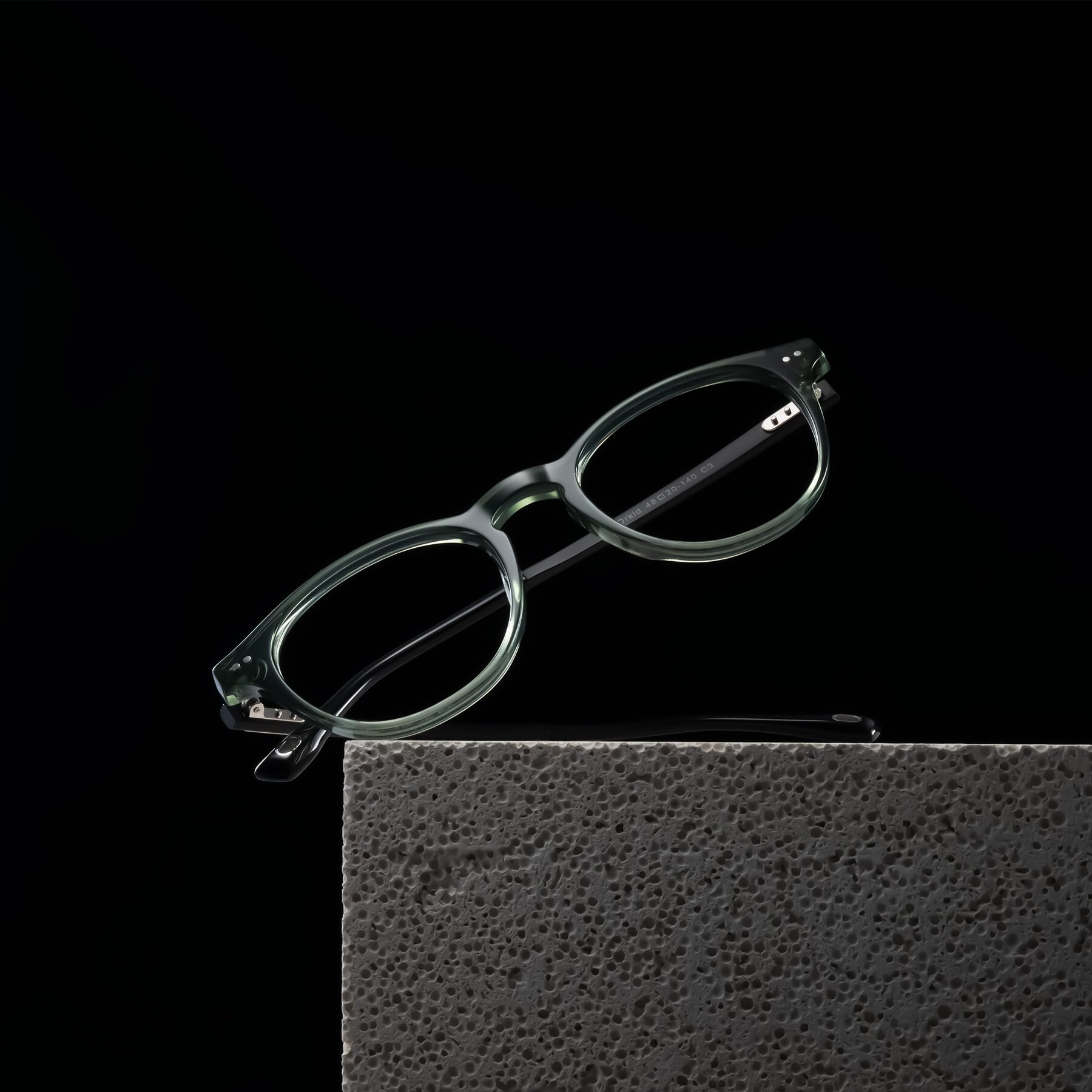 Lifestyle photography #1 of Orkid in Green/Black with Clear Blue Light Blocking Lenses