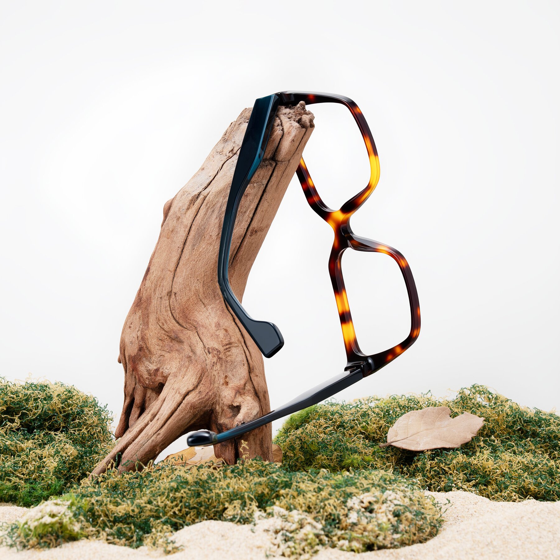 Lifestyle photography #2 of Gwee in Trortoise/Teal Striped with Clear Eyeglass Lenses