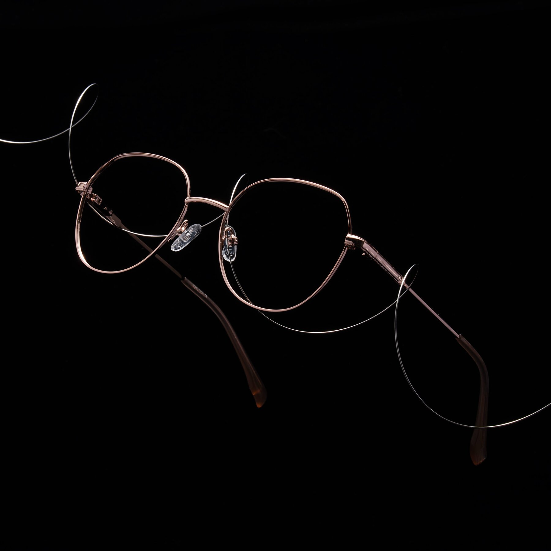 Lifestyle photography #2 of Deva in Gold with Clear Eyeglass Lenses