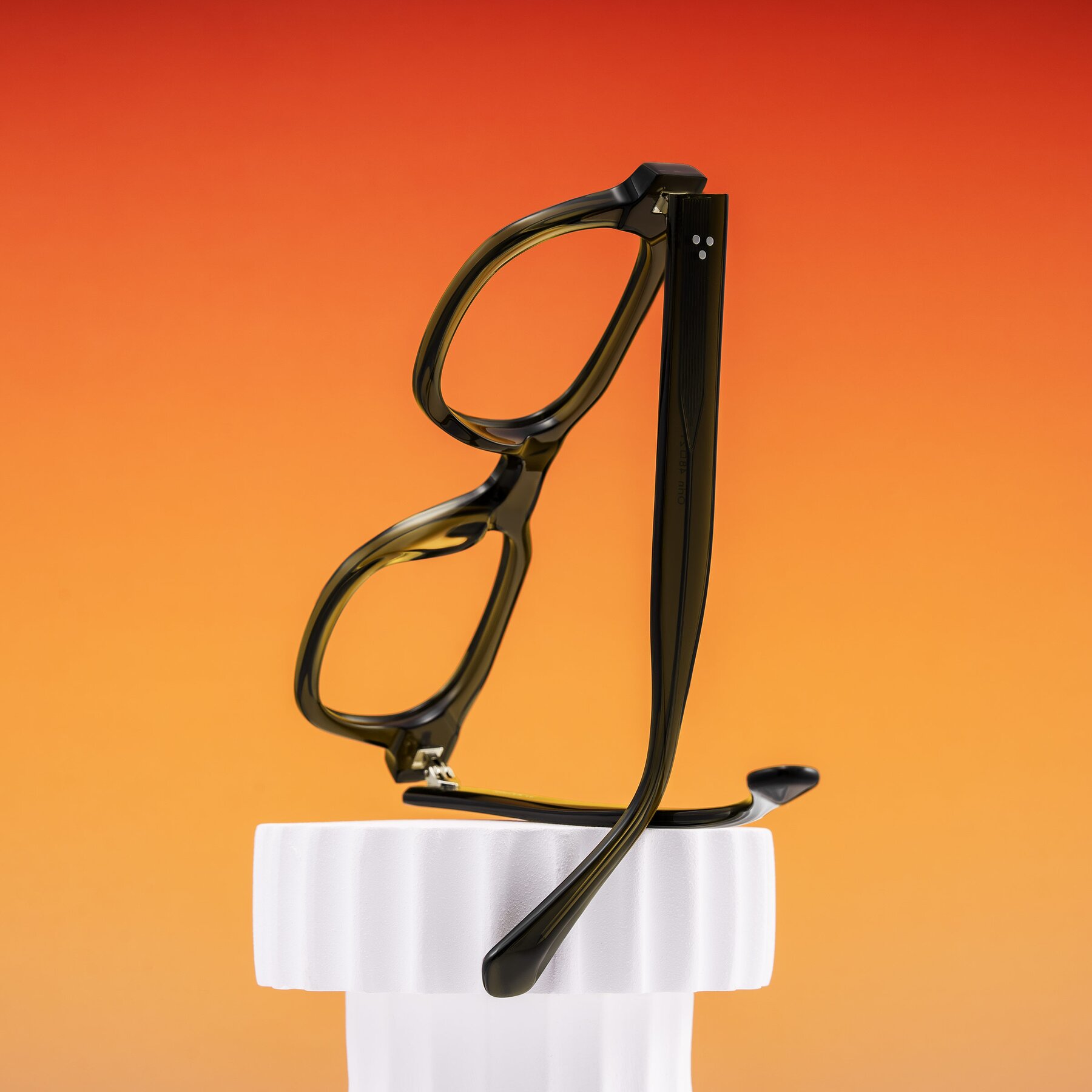 Lifestyle photography #2 of Orin in Translucent Olive Green with Clear Reading Eyeglass Lenses