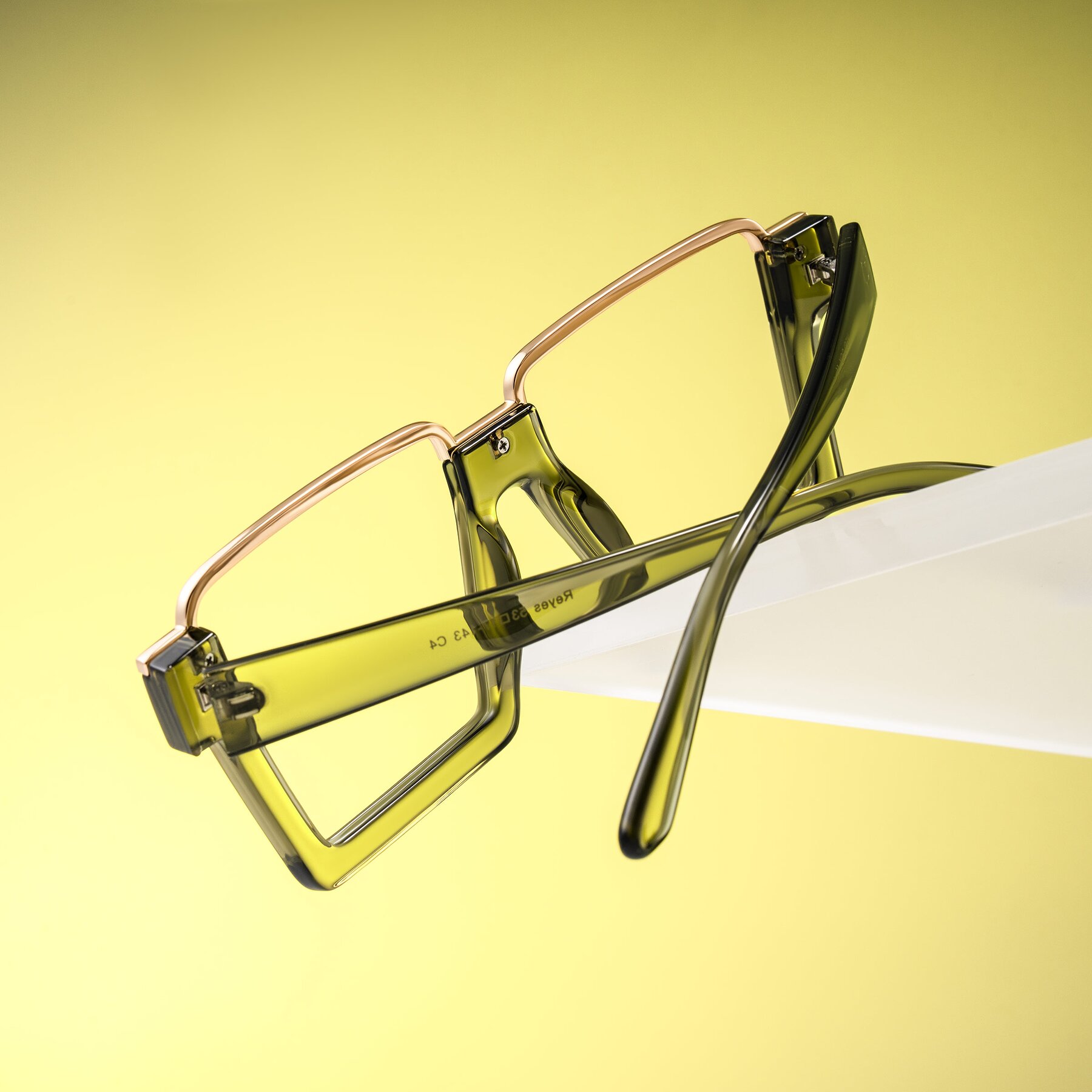 Lifestyle photography #2 of Reyes in Green with Clear Eyeglass Lenses