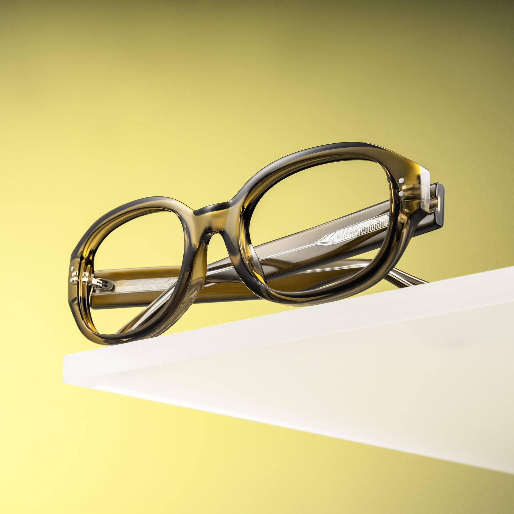 Lifestyle photography #1 of Novak in Translucent Olive Gray with Clear Reading Eyeglass Lenses