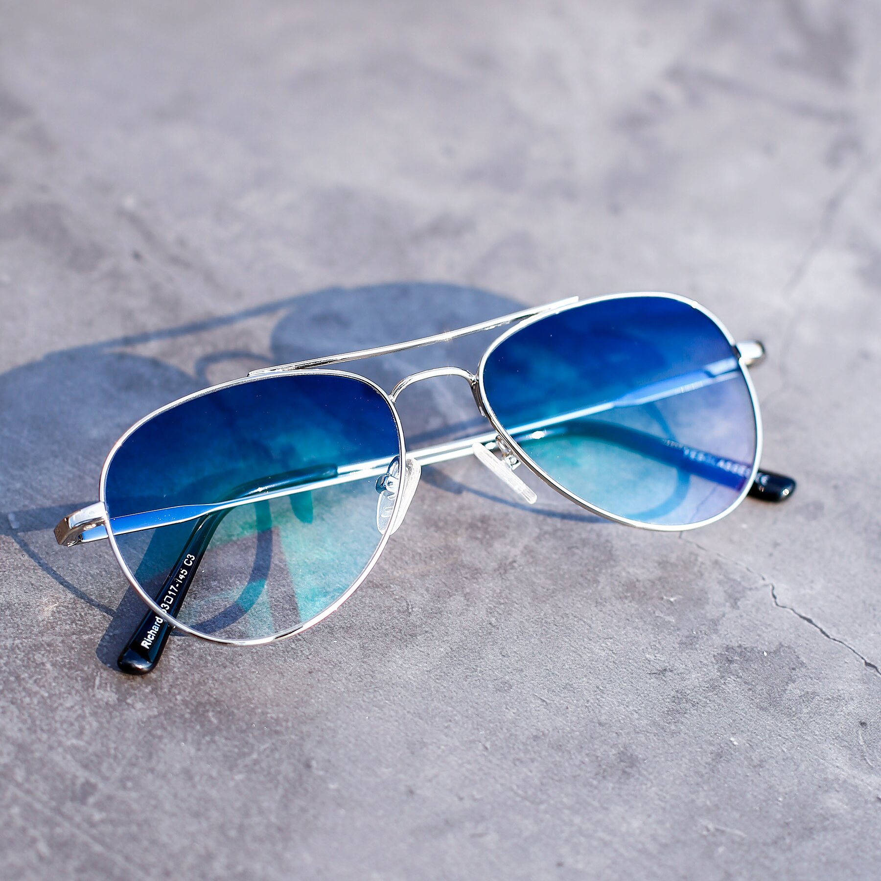 Lifestyle photography #1 of Richard in Silver with Blue Gradient Lenses