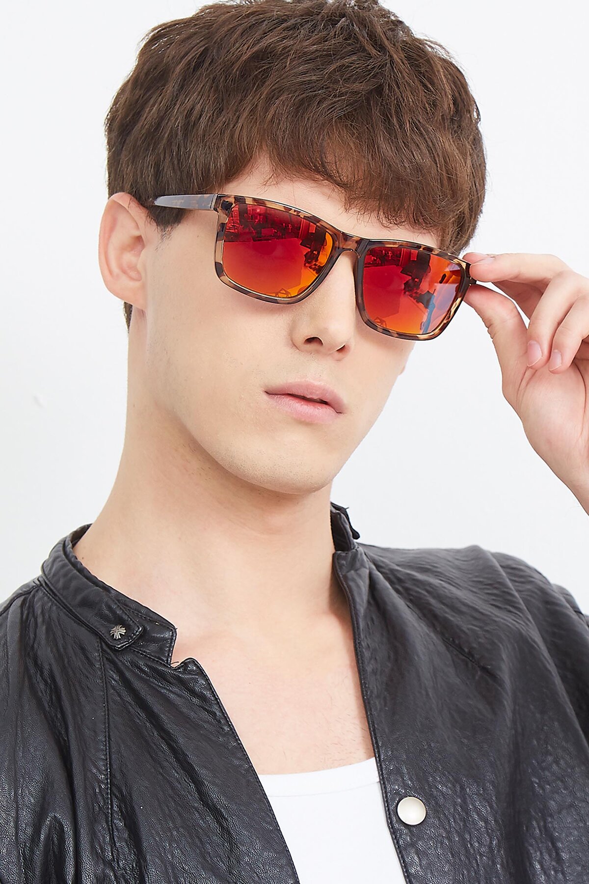 Men's lifestyle photography (portrait-2) of Sheldon in Black with Red Gold Mirrored Lenses