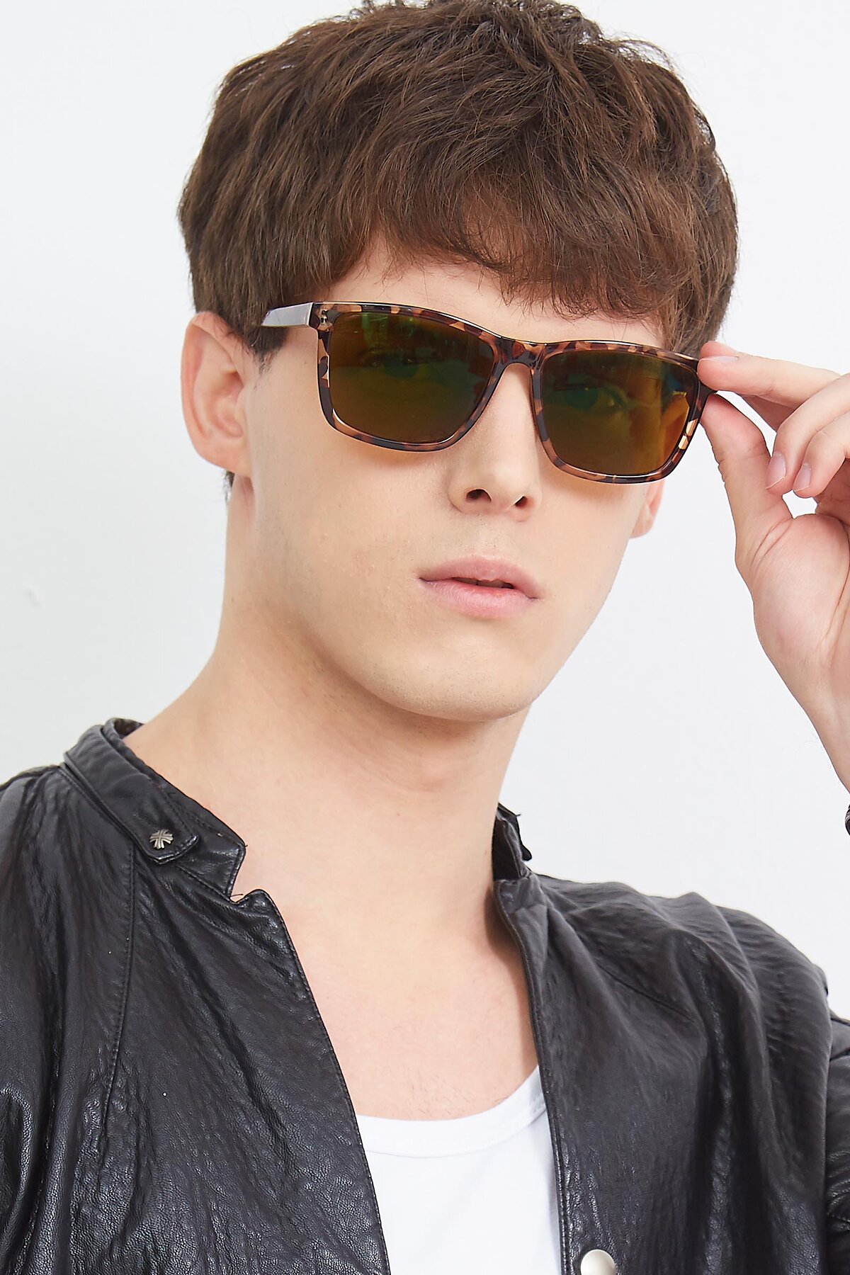 Men's lifestyle photography (portrait-1) of Sheldon in Black with Brown Polarized Lenses