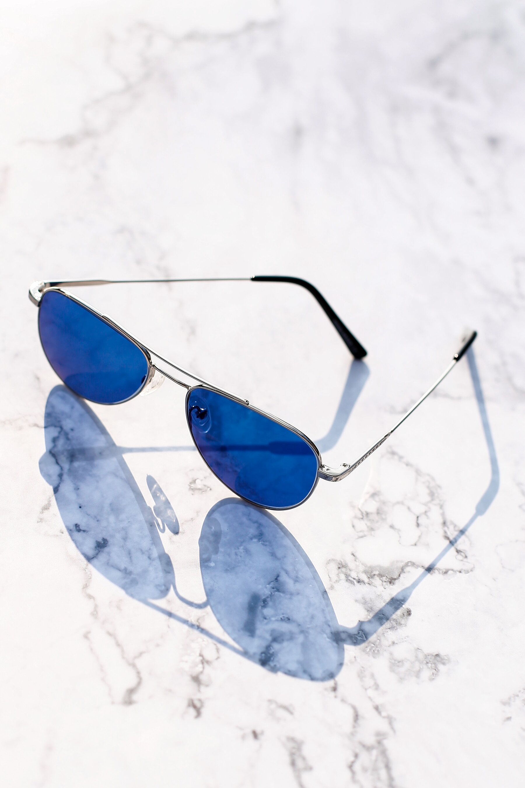 Lifestyle photography #4 of Richard in Silver with Blue Tinted Lenses