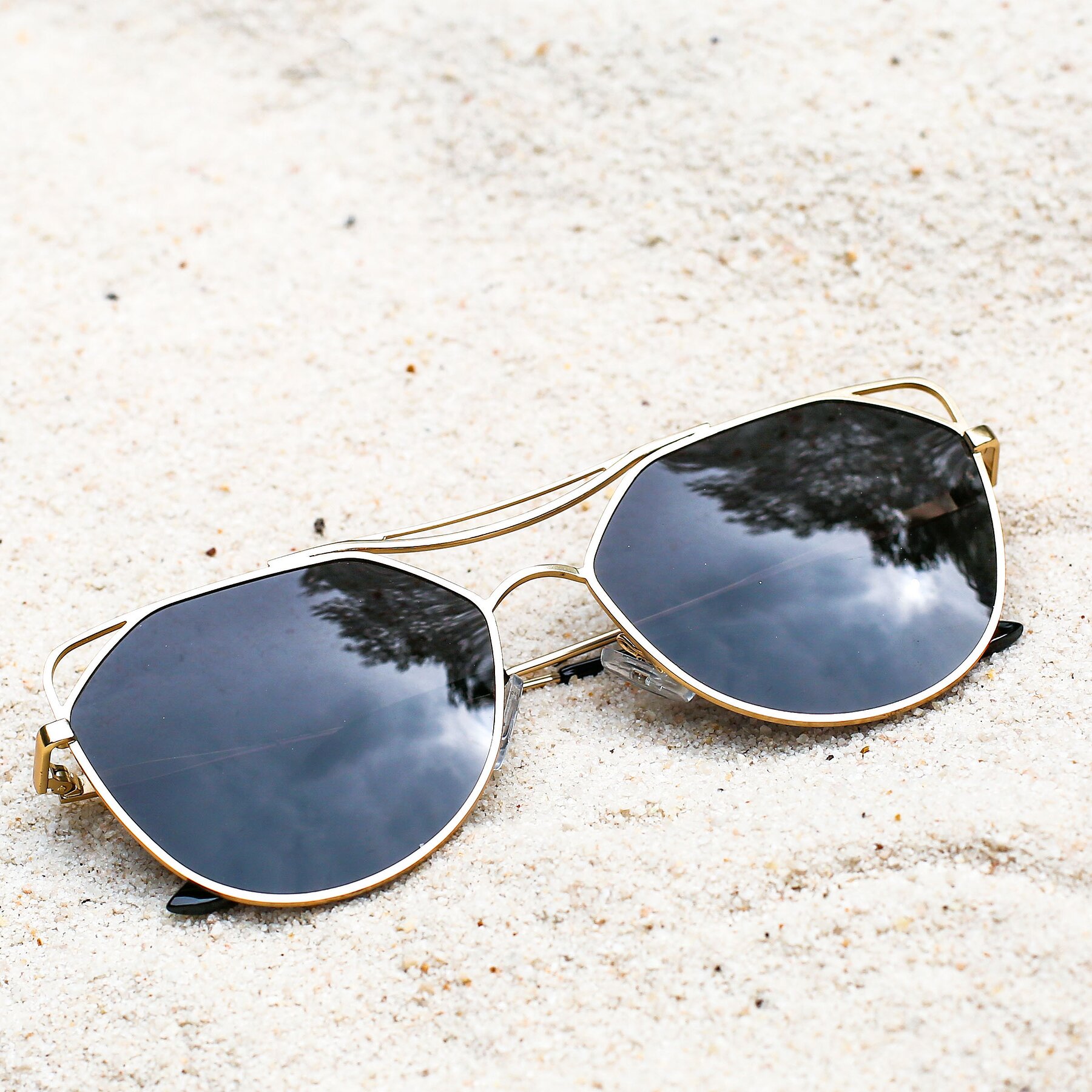 Women's lifestyle photography #1 of JC2036 in Matte Gold with Gray Polarized TAC Lenses