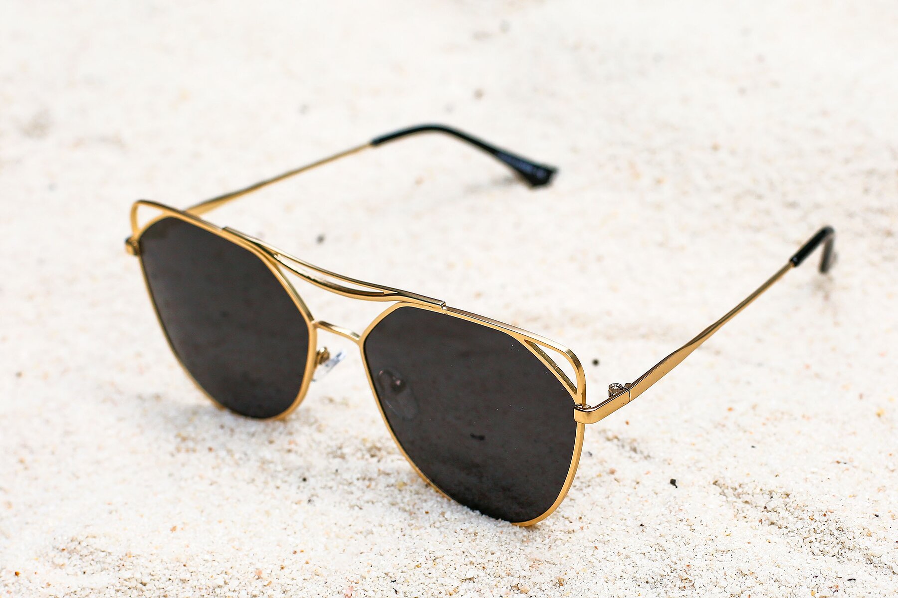 Women's lifestyle photography #2 of JC2036 in Matte Gold with Gray Polarized TAC Lenses
